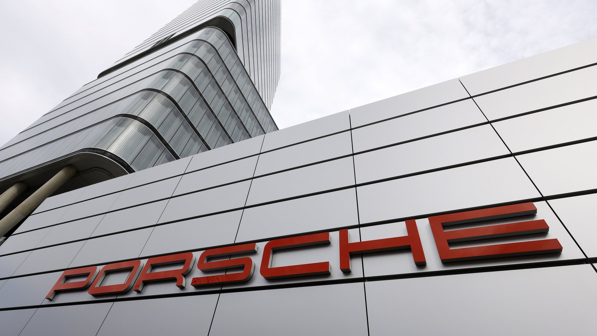 epa10519869 A logo of German car manufacturer Porsche at a Porsche car dealer in Stuttgart, Germany, 13 March 2023. Porsche reported a growth of 13.6 percent in group sales revenue to 37.6 billion euros in 2022, as well as an increase of 27.4 percent in operating profit to 6.8 billion euros. Porsche AG is a listed German manufacturer of luxury sports cars, SUVs and sedans based in Stuttgart. Porsche AG will present the results of the 2022 financial year at the annual press conference on 13 March 2023.  EPA/RONALD WITTEK