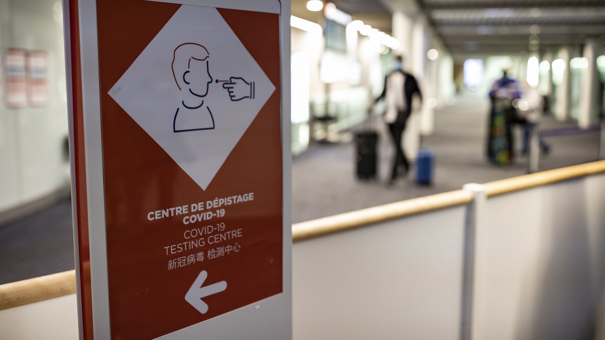 epa09158051 A sign indicates the way to a sanitary control point for passengers arriving from countries listed as red zones, at the passport control area of Roissy Charles de Gaulle airport in Roissy near Paris, France, 25 April 2021. Passengers arriving in France from Brazil, Chile, Argentina, South Africa, India and Guyana must submit to a Covid19 antigenic test and follow a 10 day quarantine at home, to curb the spread of Covid19 coronavirus variants.  EPA/IAN LANGSDON /POOL