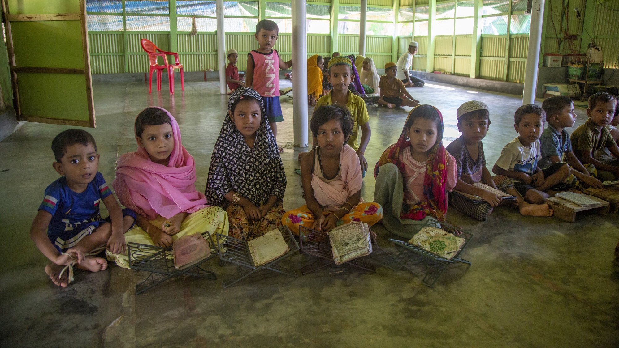 epa10136249 Rohingya refugees children read the Koran at the mosque of a makeshift camp in Kutubpalang, Ukhiya Cox Bazar district, Bangladesh, 24 August 2022. 25 August 2022 will mark five years since the exodus of the Rohingya Muslim ethnic minority from predominantly Buddhist Myanmar began in August 2017. According to the United Nations High Commissioner for Refugees (UNHCR), nearly 925,000 Rohingya refugees live in Bangladesh and Cox’s Bazar region after they fled Myanmar, especially since the start of the military crackdown in 2017 which the UN described as ethnic cleansing and possible genocide. Attempts for the repatriation of refugees from Bangladesh to Myanmar failed as Rohingyas refused to return home without a guarantee of citizenship and security.  EPA/MONIRUL ALAM