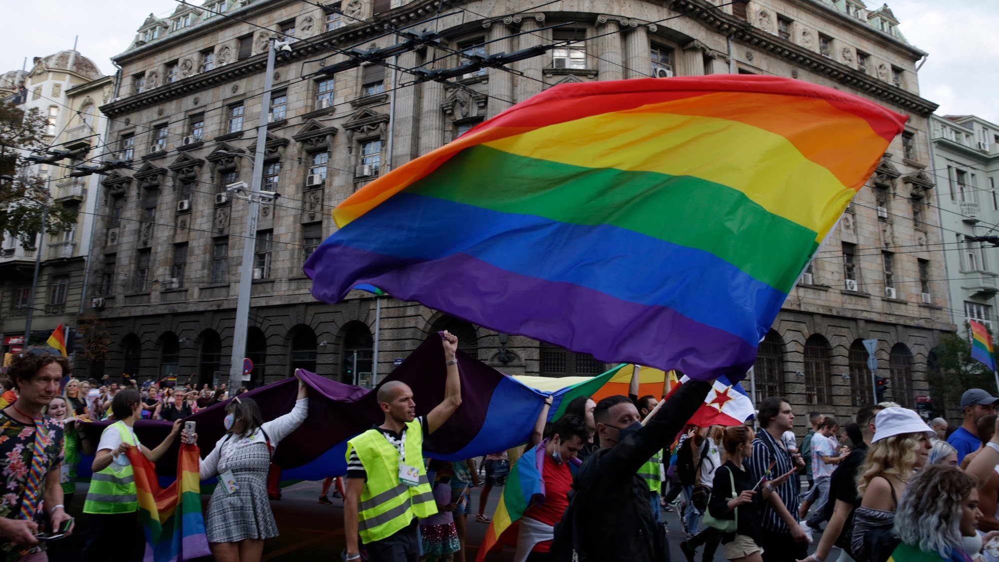 epa09475379 Participants wave a rainbow colored flag during the Belgrade Pride Parade march in Belgrade, Serbia, 18 September 2021. Holding rainbow colored flags, balloons and banners participants marched through the main streets of Serbia&#039;s capital near the main institutions in the city to which Belgrade Pride has been addressing its demands for improved rights for the LGBTQ+ community.  EPA/ANDREJ CUKIC