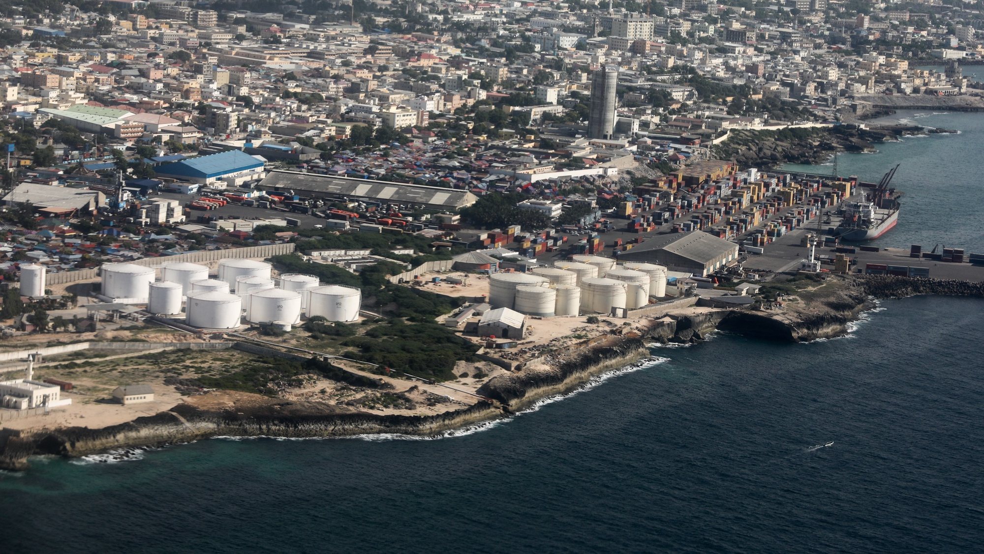 epa08075483 An aerial view picture shows the Mogadishu International Port in Mogadishu, Somalia, 14 December 2019 (issued 16 October 2019). The Somali capital is split into two totally separate worlds by a kilometer-long bomb-proof barrier: the conflict-riddled Mogadishu and the secure &#039;Green Zone&#039;, an urban bubble which is home to UN personnel, diplomats, bodyguards, soldiers and spies.  EPA/Daniel Irungu