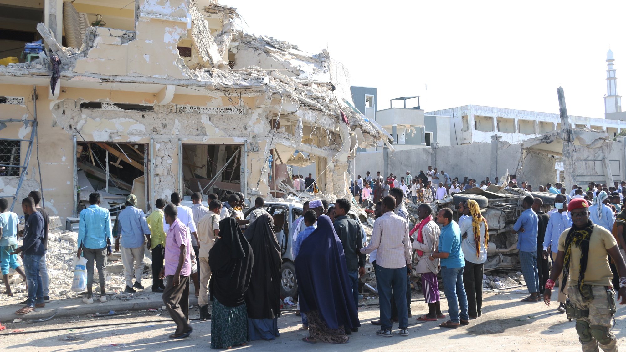 epa10274749 A damaged building in the aftermath of two explosions in Mogadishu, Somalia, 30 October 2022. At least 100 people were killed and over 300 were injured on 29 October, when two car bombs exploded at a busy junction near key government offices, Somali President Hassan Sheikh Mohamud said on 30 October during a media statement at the scene of the twin blasts. The attack occurred five years after a massive blast at the same location killed hundreds of people.  EPA/SAID YUSUF WARSAME