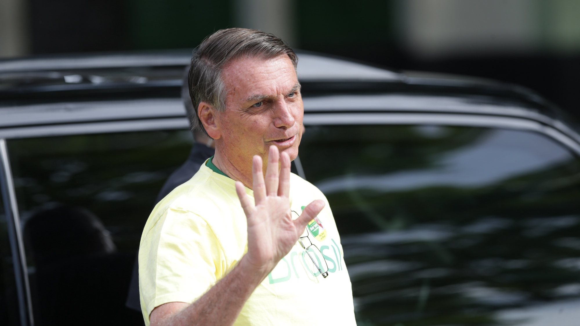 epa10275046 Brazilian president and candidate for re-election Jair Bolsonaro meets supporters as he arrives to vote at a polling station in Rio de Janeiro, Brazil, 30 October 2022.  EPA/ANDRE COELHO