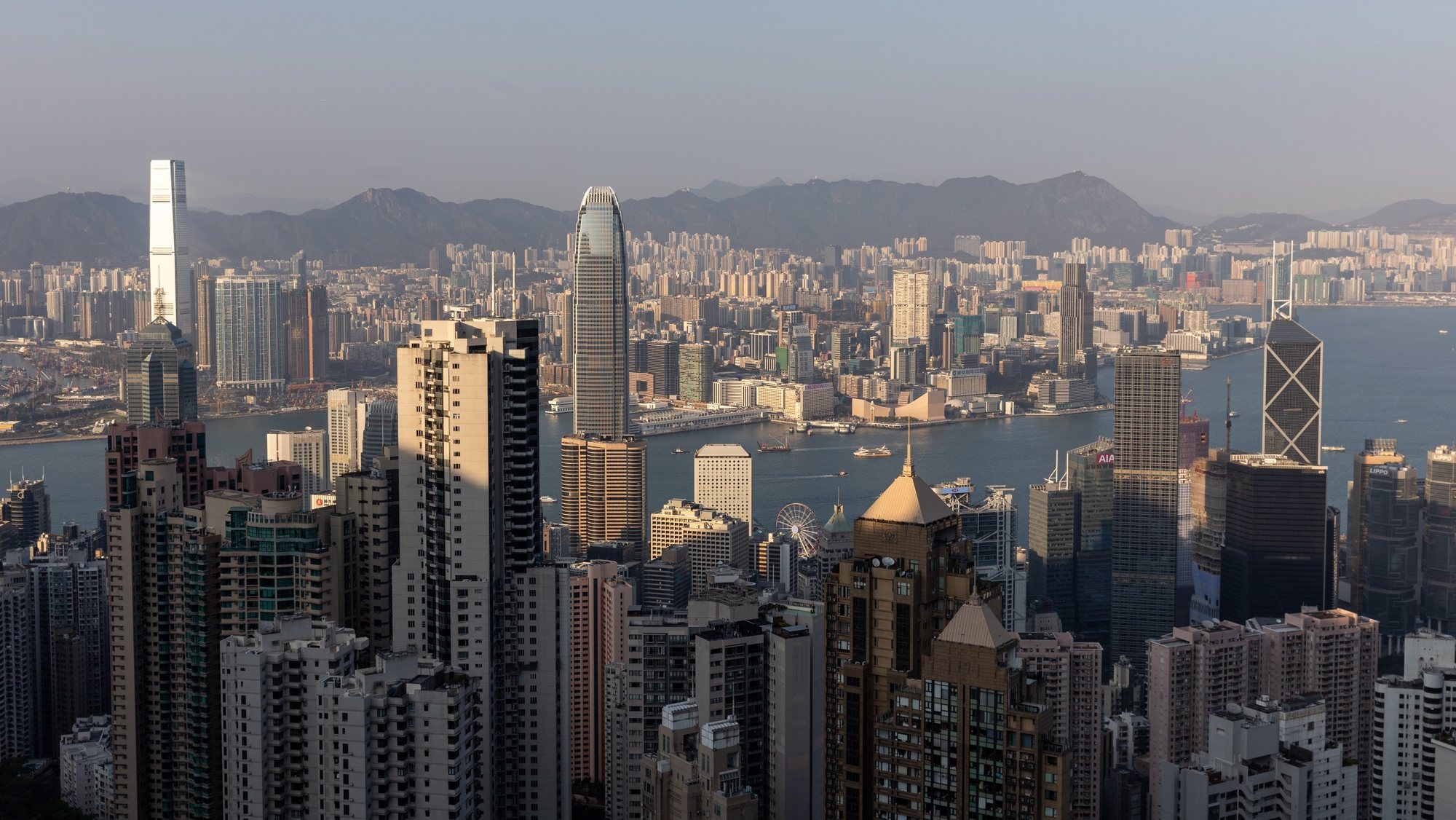 epa10494920 Residential and commercial buildings stand on Hong Kong Island and the Kowloon Peninsula city in Hong Kong, China, 28 February 2023. Hong Kong will scrap the mask mandate for all indoor and outdoor places after almost 3 years on 01 March 2023.  EPA/JEROME FAVRE