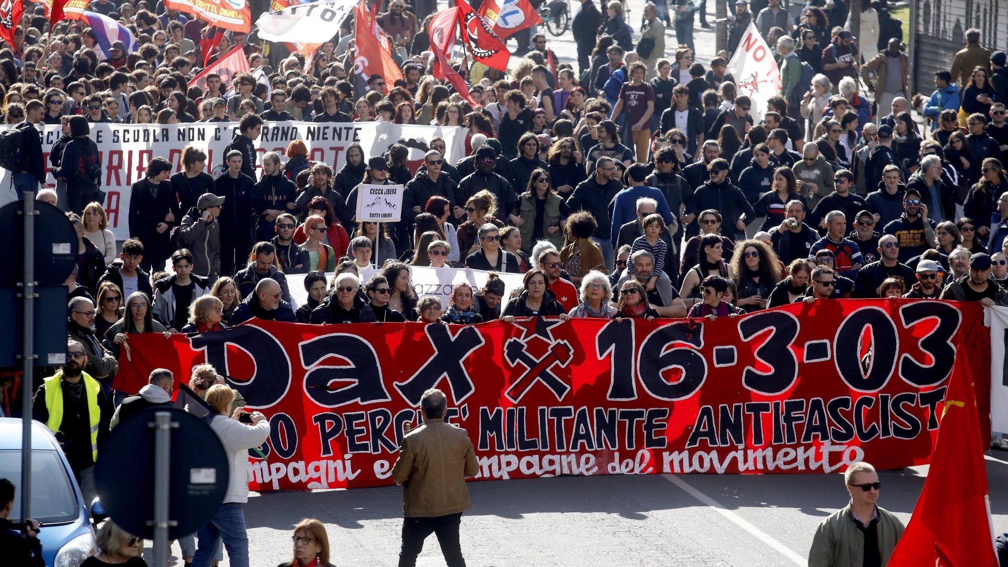 epa10530549 People march during an anti-fascist network rally for the twentieth anniversary of the murder of Davide &#039;Dax&#039; Cesare, a member of the Orso social center, stabbed to death by three men of the extreme right, in Milan, Italy, 18 March 2023. The demonstration gathered representatives of trade unions such as Adl Cobas and some social centers. This year the memory of Dax joins that of Fausto Tinelli and Lorenzo &#039;Iaio&#039; Iannucci, killed on 18 March 1978.  EPA/MOURAD BALTI TOUATI