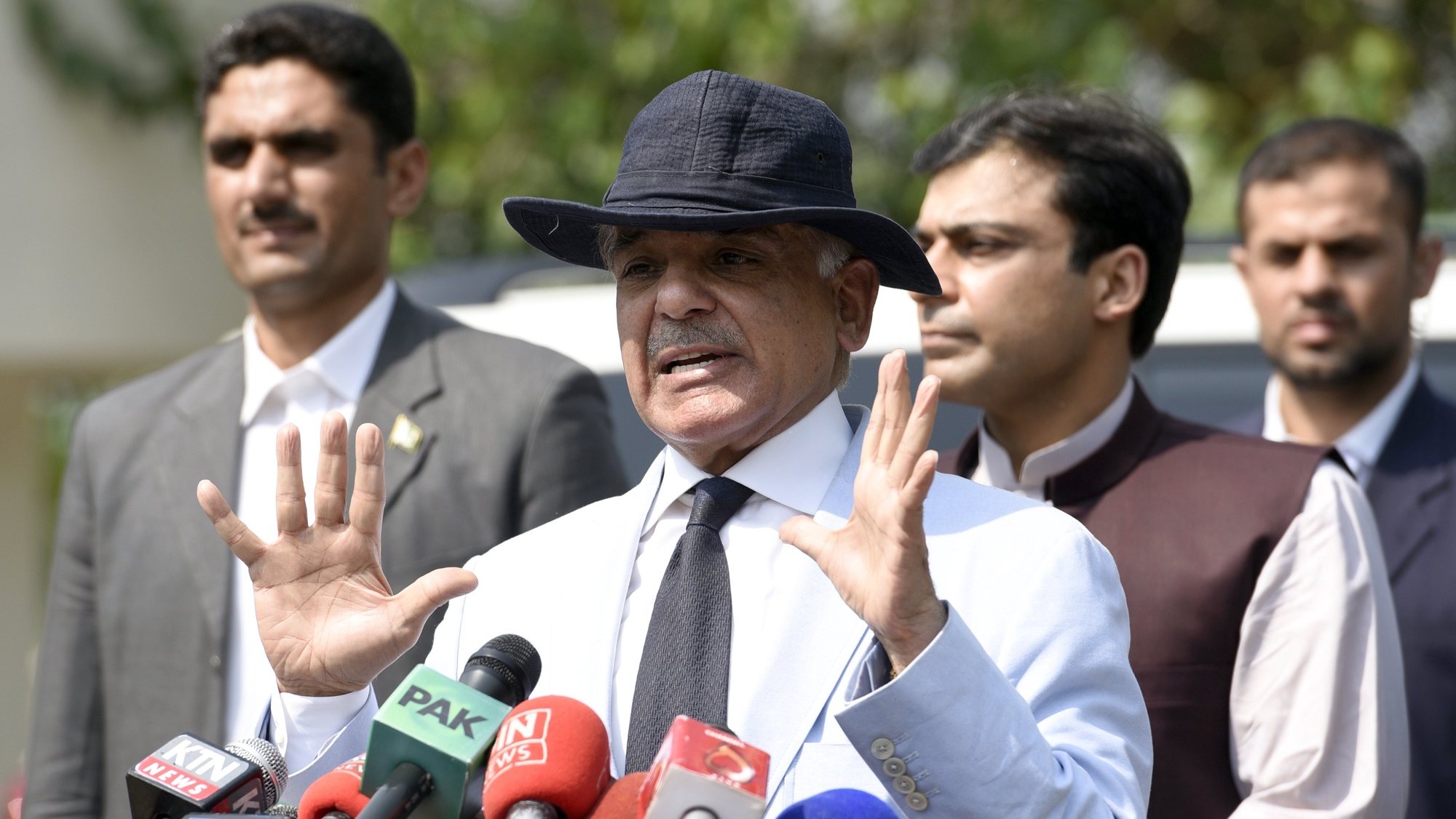 epa06033418 Punjab Chief Minister Shehbaz Sharif (C) talks with journalists after appearing before an investigation team formed by the Supreme Court of Pakistan to investigate the Sharif family&#039;s offshore properties that appeared in Panama papers, in Islamabad, Pakistan, 17 June 2017. The Pakistani Supreme Court on 20 April 2017 ordered the creation of a new commission to investigate the source of funds from companies associated with the family of Prime Minister Nawaz Sharif, after he was implicated in the massive Panama Papers scandal in 2016. Five judges in charge of the case, also concluded there was insufficient evidence to disqualify Sharif from his position.  EPA/T. MUGHAL