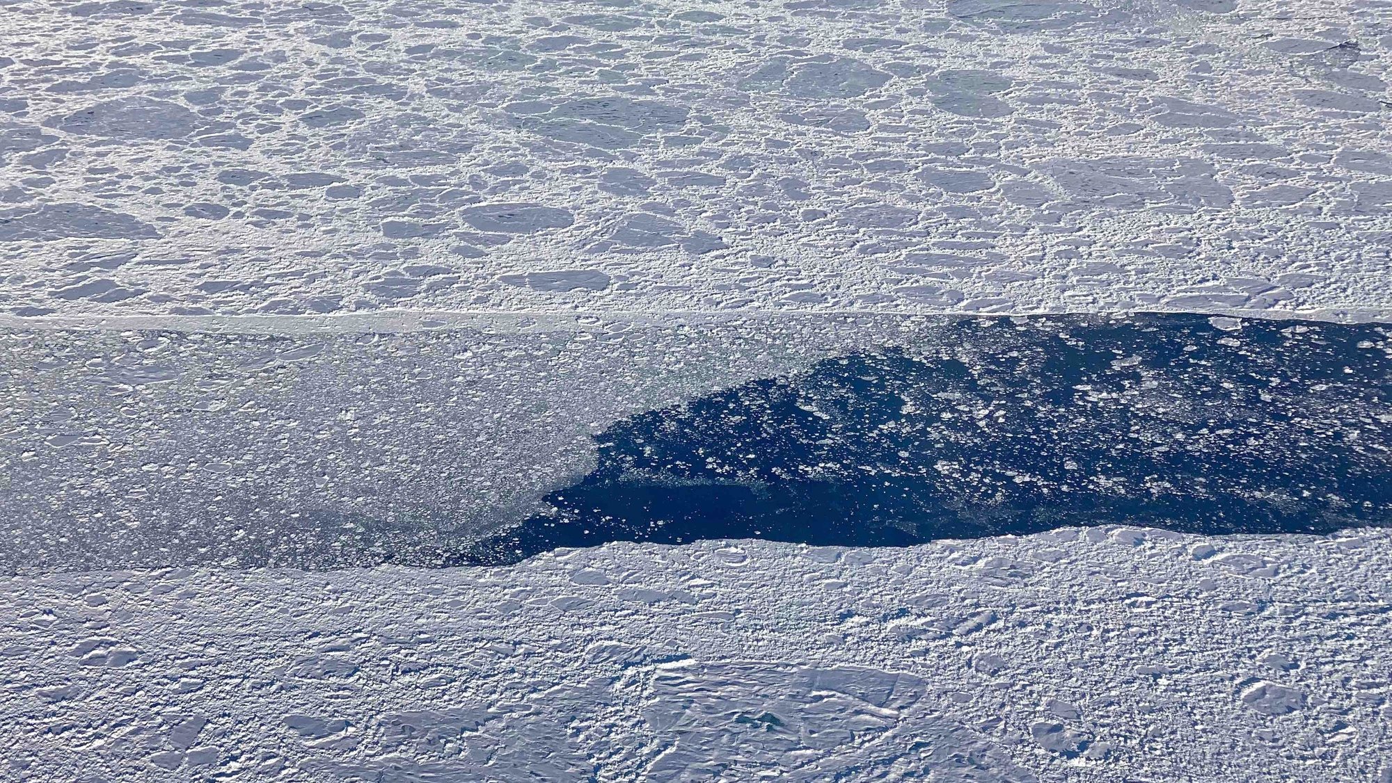epa07867656 A handout photo made available by NASA shows an aerial view taken during an Operation IceBridge flight of an opening in the sea ice cover, partially filled in by much smaller sea ice rubble and floes, north of Greenland, 09 September 2019 (issued 25 September 2019). Arctic sea ice likely reached its 2019 minimum extent on 18 September 2019. At 4.15 million square kilometers this year&#039;s summertime extent is effectively tied for the second in the satellite record, according to NASA and the National Snow and Ice Data Center. The Arctic sea ice cap is an expanse of frozen seawater floating on top of the Arctic Ocean and neighboring seas. Every year, it expands and thickens during the fall and winter and grows smaller and thinner during the spring and summer. Changes in Arctic sea ice cover have wide-ranging impacts. The sea ice affects local ecosystems, regional and global weather patterns, and the circulation of the oceans.  EPA/NASA/LINETTE BOISVERT HANDOUT  HANDOUT EDITORIAL USE ONLY/NO SALES