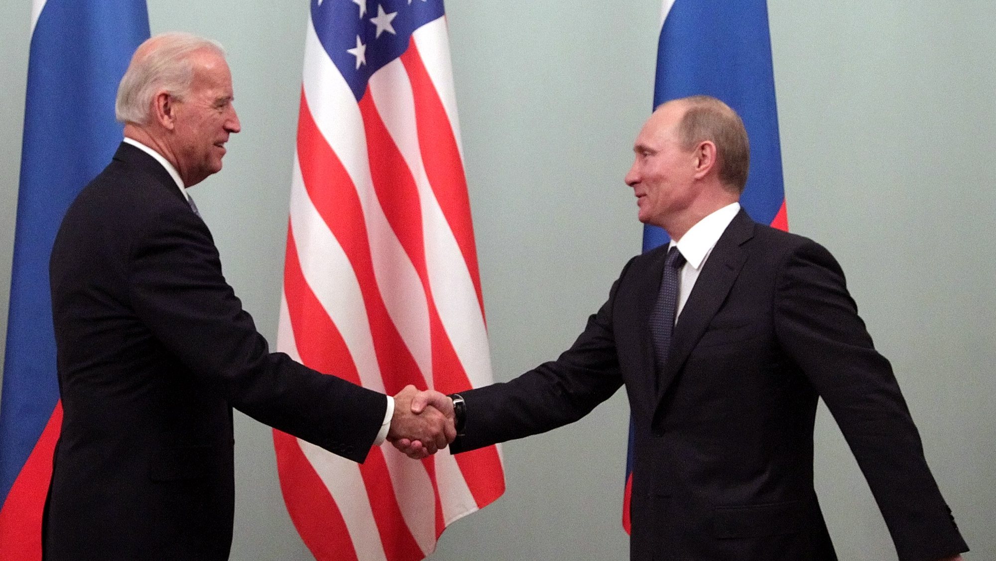 epa08884610 Then US Vice President Joe Biden (L) shakes hands with then Russian Prime Minister Vladimir Putin during their meeting in Moscow, Russia, 10 March 2011 (reissued 15 December 2020). Russian President Vladimir Putin congratulated Joe Biden for his victory in the US presidential election in a telegram published on the Kremlin&#039;s website on 15 December 2020.  EPA/MAXIM SHIPENKOV