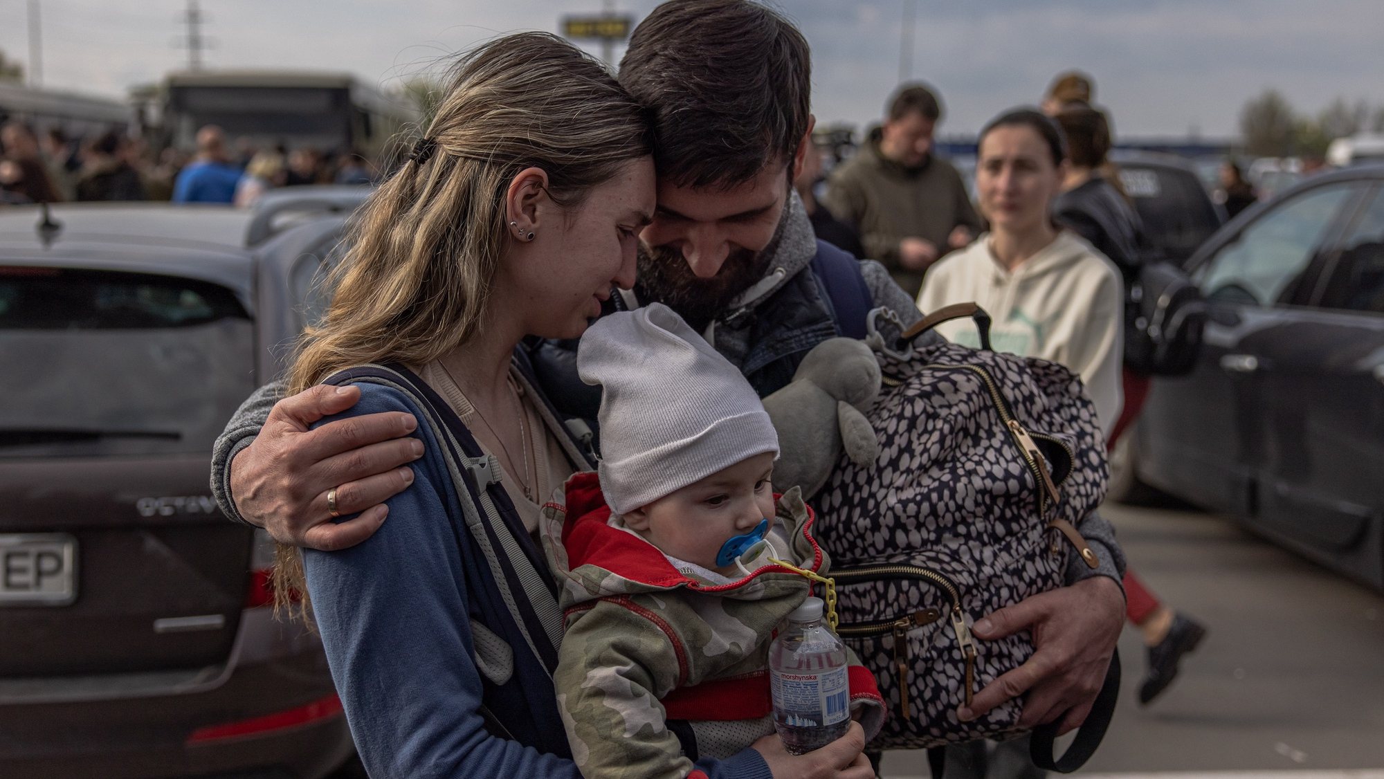 epa09924897 A man welcomes Anna and her son Svyatoslav who were evacuated from Mariupol at the evacuation point in Zaporizhzhia, Ukraine, 03 May 2022. Around 100 civilians were evacuated from the steel plant, the last Ukrainian-controlled area in the southern port city of Mariupol, according to Ukrainian officials. Thousands of people who were still in Mariupol and other areas in South Ukraine occupied by the Russian army waited to be evacuated to Ukraine&#039;s controlled area by buses and their own cars.  EPA/ROMAN PILIPEY