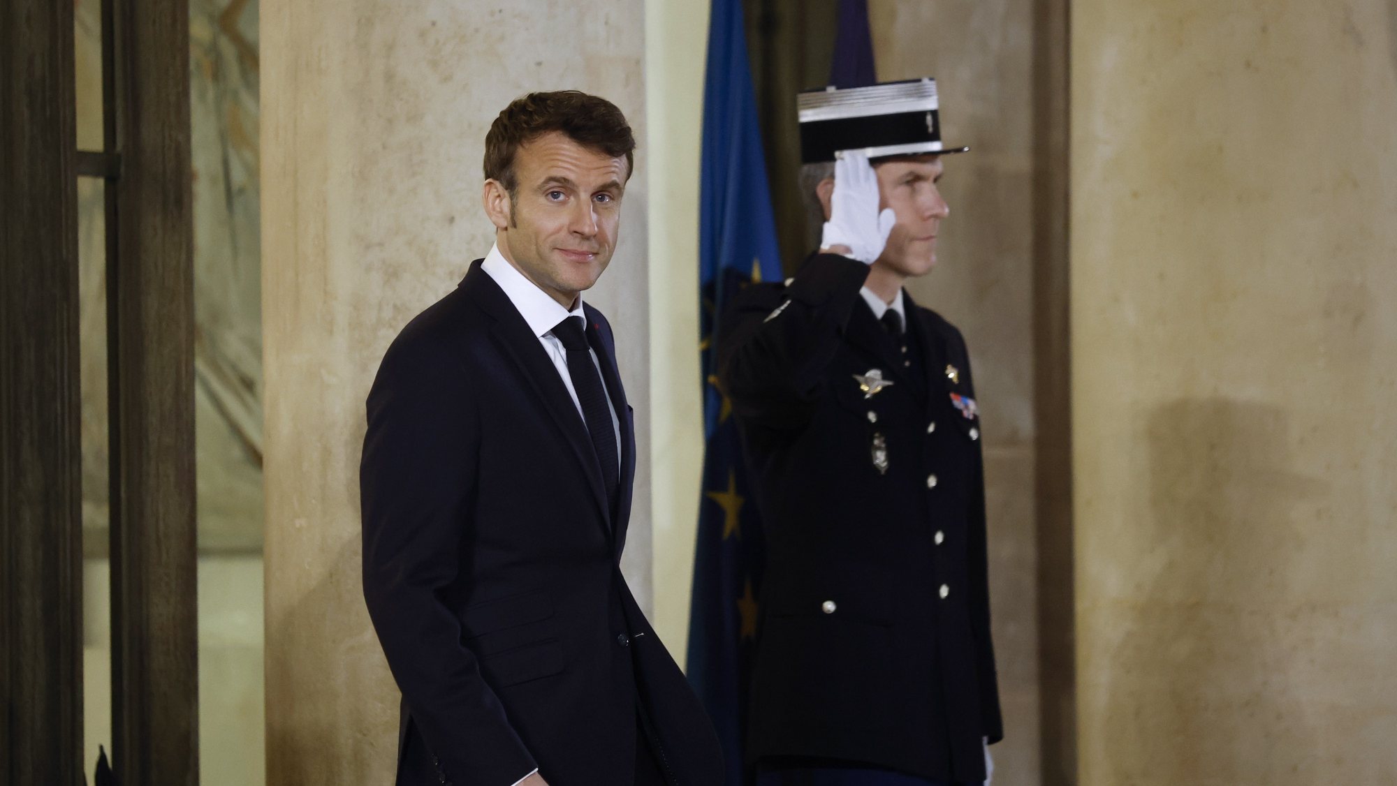 epa10444701 French President Emmanuel Macron walks out of Elysee Palace to welcome Israeli Prime Minister Benjamin Netanyahu (not pictured) upon his arrival in Paris, France, 02 February 2023.  EPA/YOAN VALAT
