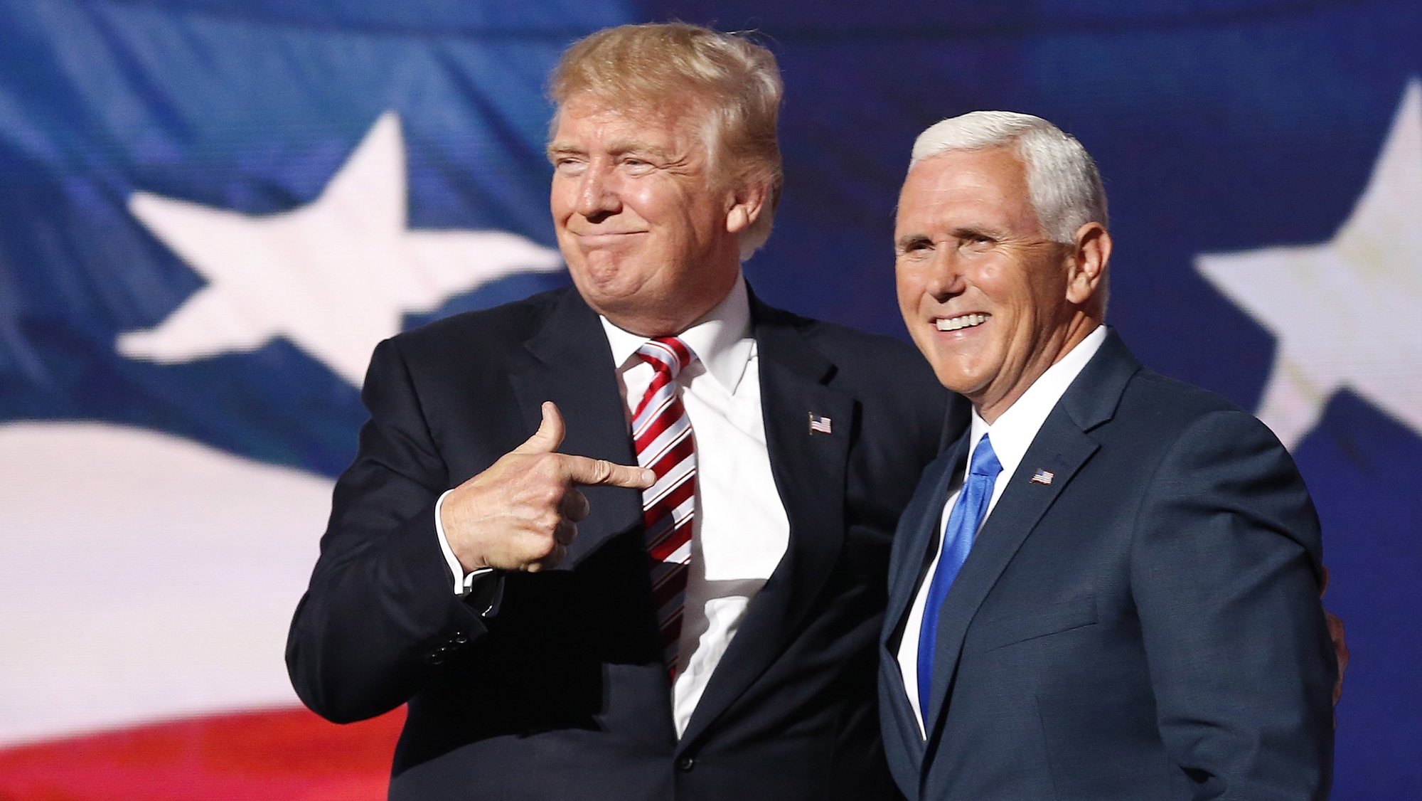 epa08939628 (FILE) Republican Presidential nominee Donald J. Trump (L) embraces Indiana Governor and Republican Vice Presidential nominee Mike Pence (R) during the third day of the 2016 Republican National Convention at Quicken Loans Arena in Cleveland, Ohio, USA, 20 July 2016. The four-day convention ended with Donald Trump formally accepting the nomination of the Republican Party as their presidential candidate in the 2016 election. The presidency of Donald Trump, which records two presidential impeachments, will end at noon on 20 January 2021.  EPA/MICHAEL REYNOLDS *** Local Caption *** 53089650