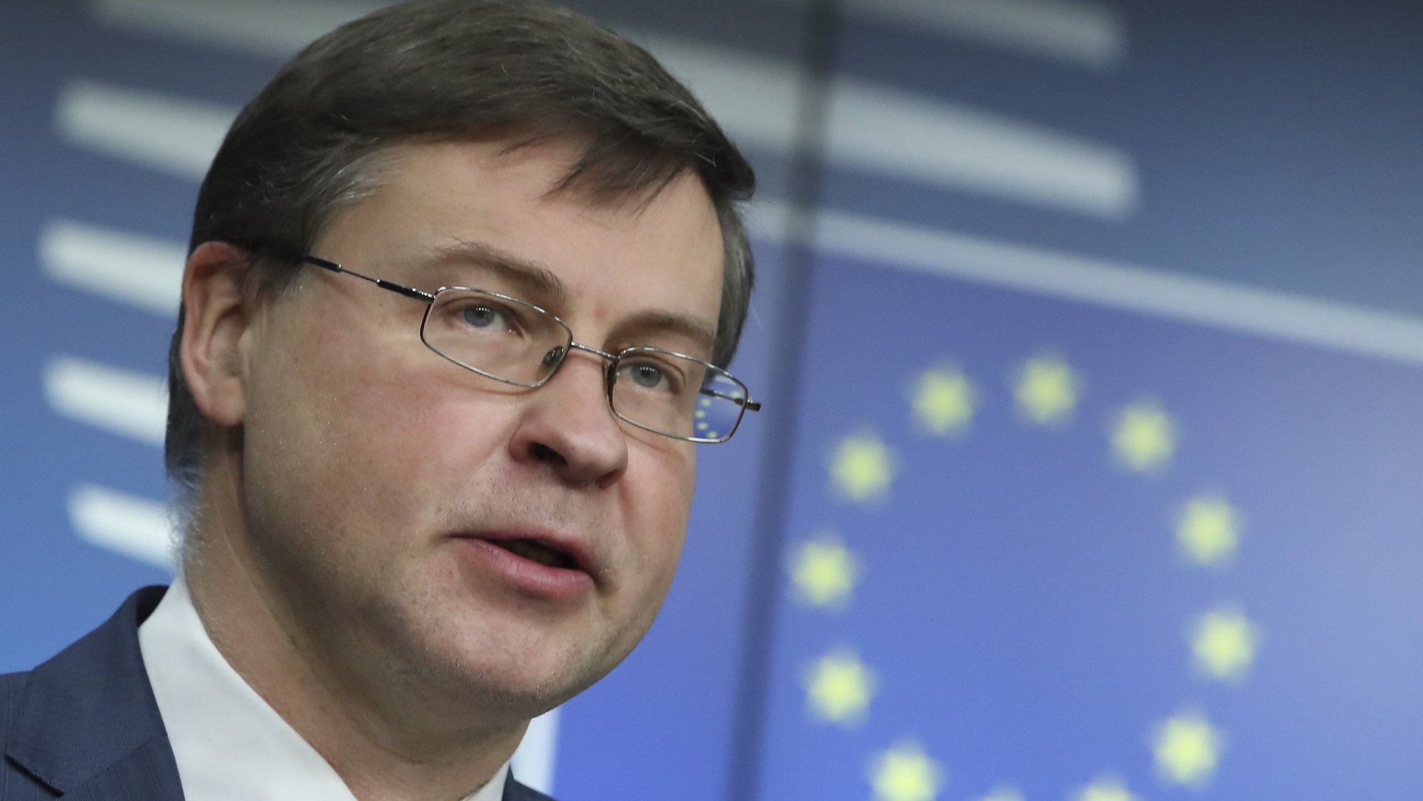 epa09077910 European Commission Vice-President Valdis Dombrovskis speaks during a news conference following a European Union finance ministers meeting in Brussels, Belgium, 16 March 2021.  EPA/YVES HERMAN / POOL