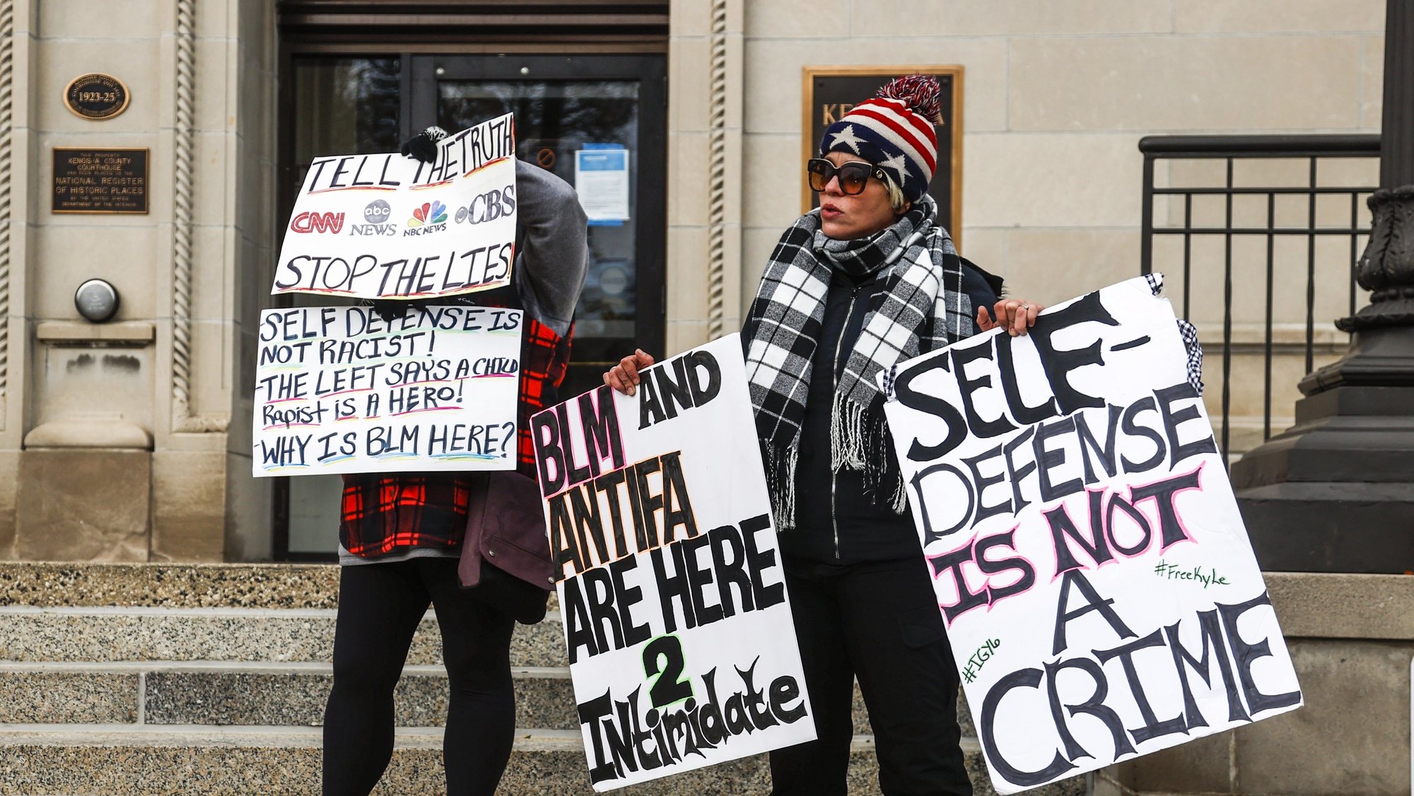 epa09585743 Protesters stand outside the Kenosha County courthouse as the jury deliberates in the trial of Kyle Rittenhouse, in Kenosha, Wisconsin, USA, 16 November 2021. Rittenhouse is being tried for the fatal shootings of Joseph Rosenbaun and Anthony Huber, and the wounding of Gaige Grosskreutz on 25 August 2020 during civil unrest in response to the police shooting of Jacob Blake.  EPA/TANNEN MAURY
