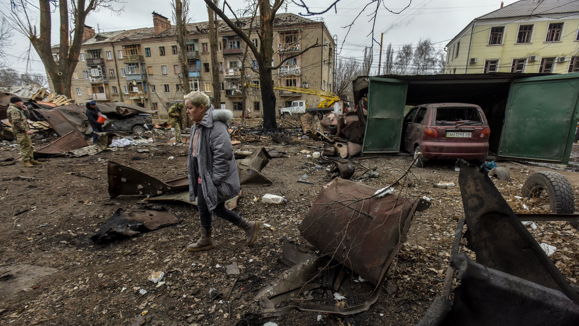 epaselect epa10436256 A local woman walks near the site of a Russian rocket strike in Konstyantynivka town, Donetsk region, eastern Ukraine, 28 January 2023. Three civilians were killed, and at least two injured as a result of Russia’s missile strike on the city of Kostyantynivka, according to Pavlo Kyrylenko, the head of the regional administration.  EPA/OLEG PETRASYUK