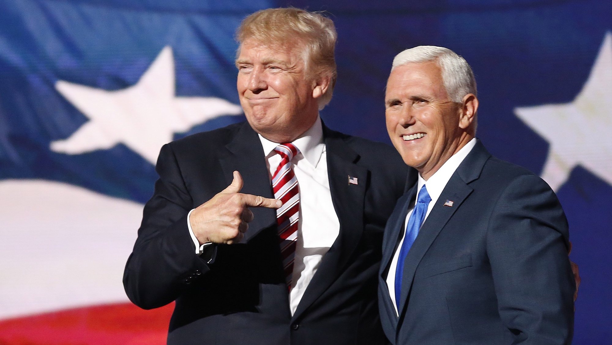 epa08939628 (FILE) Republican Presidential nominee Donald J. Trump (L) embraces Indiana Governor and Republican Vice Presidential nominee Mike Pence (R) during the third day of the 2016 Republican National Convention at Quicken Loans Arena in Cleveland, Ohio, USA, 20 July 2016. The four-day convention ended with Donald Trump formally accepting the nomination of the Republican Party as their presidential candidate in the 2016 election. The presidency of Donald Trump, which records two presidential impeachments, will end at noon on 20 January 2021.  EPA/MICHAEL REYNOLDS *** Local Caption *** 53089650