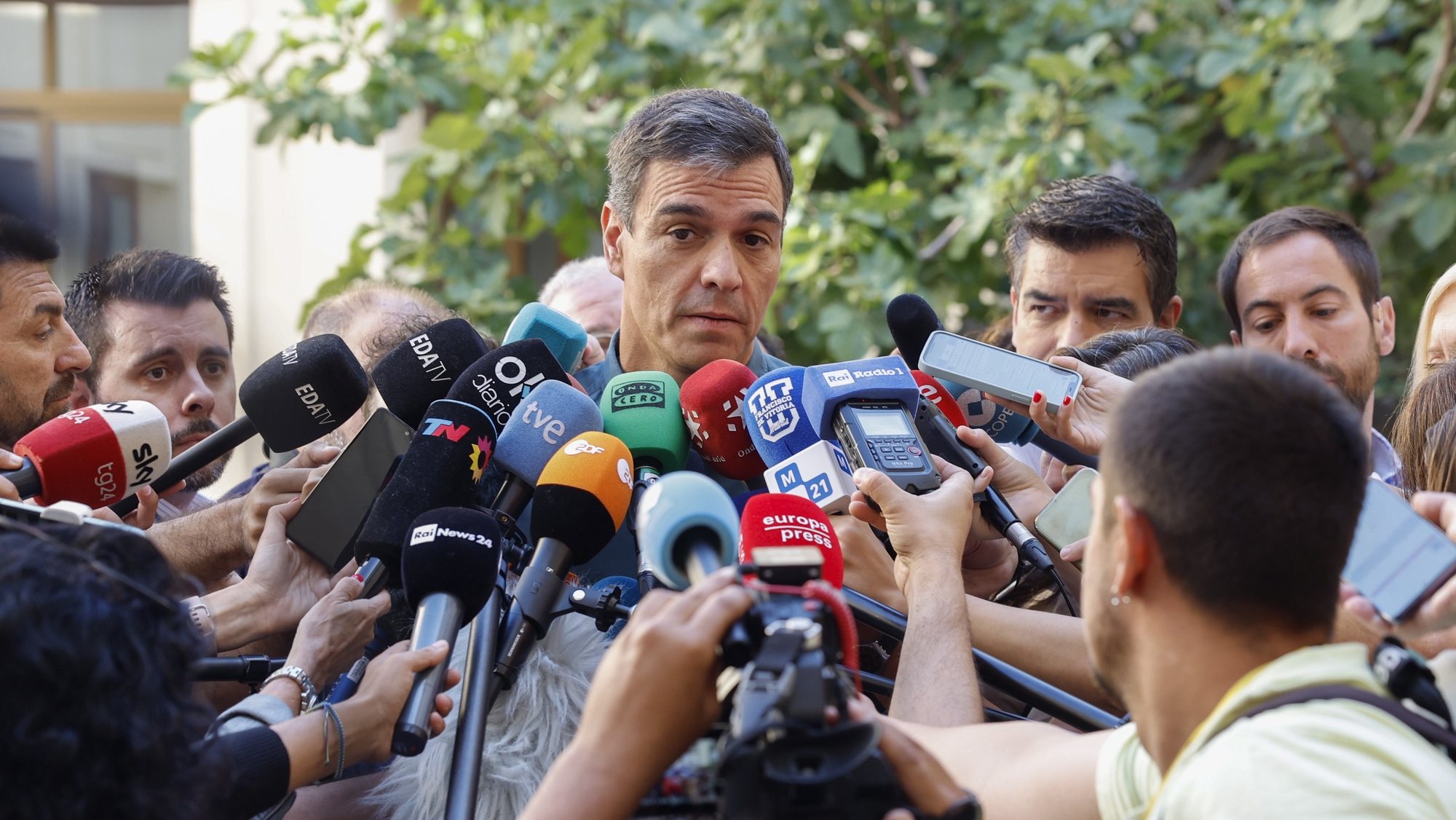 epa10763413 Spanish Prime Minister and re-election candidate, Pedro Sanchez (C), talks to media after he cast his ballot for the general elections at a polling station in Madrid, Spain, 23 July 2023.  EPA/Ballesteros