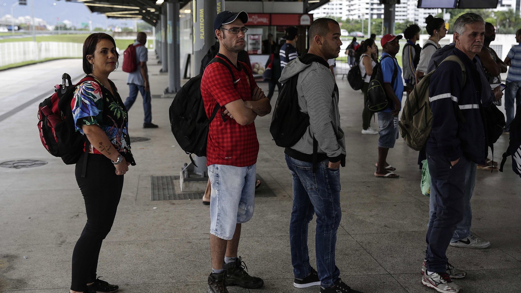 epa07922661 Brazilian teacher Isabel Vaz (L) queues up at the bus stop on her way to the school where she works in Rio de Janeiro, Brazil, 10 October 2019 (issued 15 October 2019). Isabel, 42, takes up to three buses and a train to travel 100 kilometers to work each day, one of the various drawbacks of teaching in Brazil, a job that is poorly paid and fraught with danger.  EPA/ANTONIO LACERDA  ATTENTION: This Image is part of a PHOTO SET
