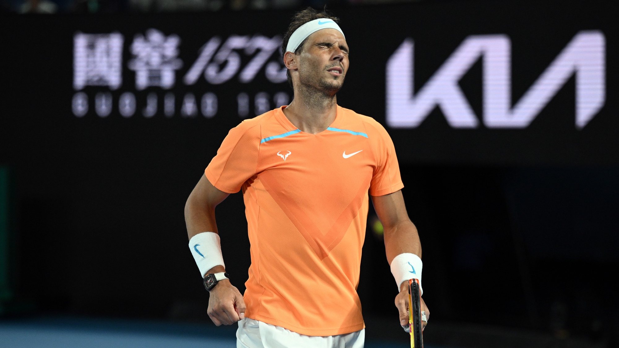 epa10412507 Rafael Nadal of Spain grimaces in pain during his match against Mackenzie McDonald of the USA of the 2023 Australian Open tennis tournament at Melbourne Park in Melbourne, Australia, 18 January 2023.  EPA/JAMES ROSS AUSTRALIA AND NEW ZEALAND OUT