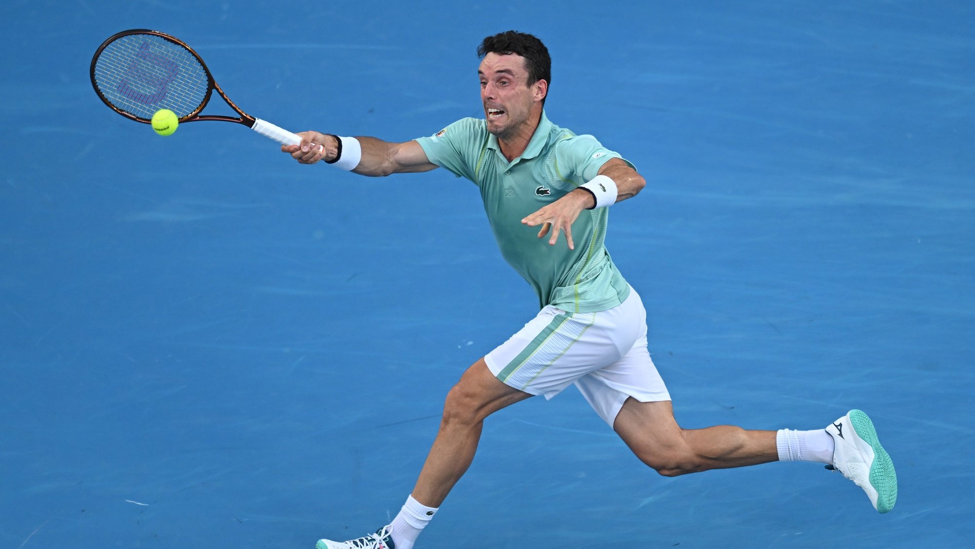epa10424331 Roberto Bautista Agut of Spain in action during his match against Tommy Paul of the United States during the 2023 Australian Open tennis tournament at Melbourne Park in Melbourne, Australia, 23 January 2023.  EPA/LUKAS COCH AUSTRALIA AND NEW ZEALAND OUT