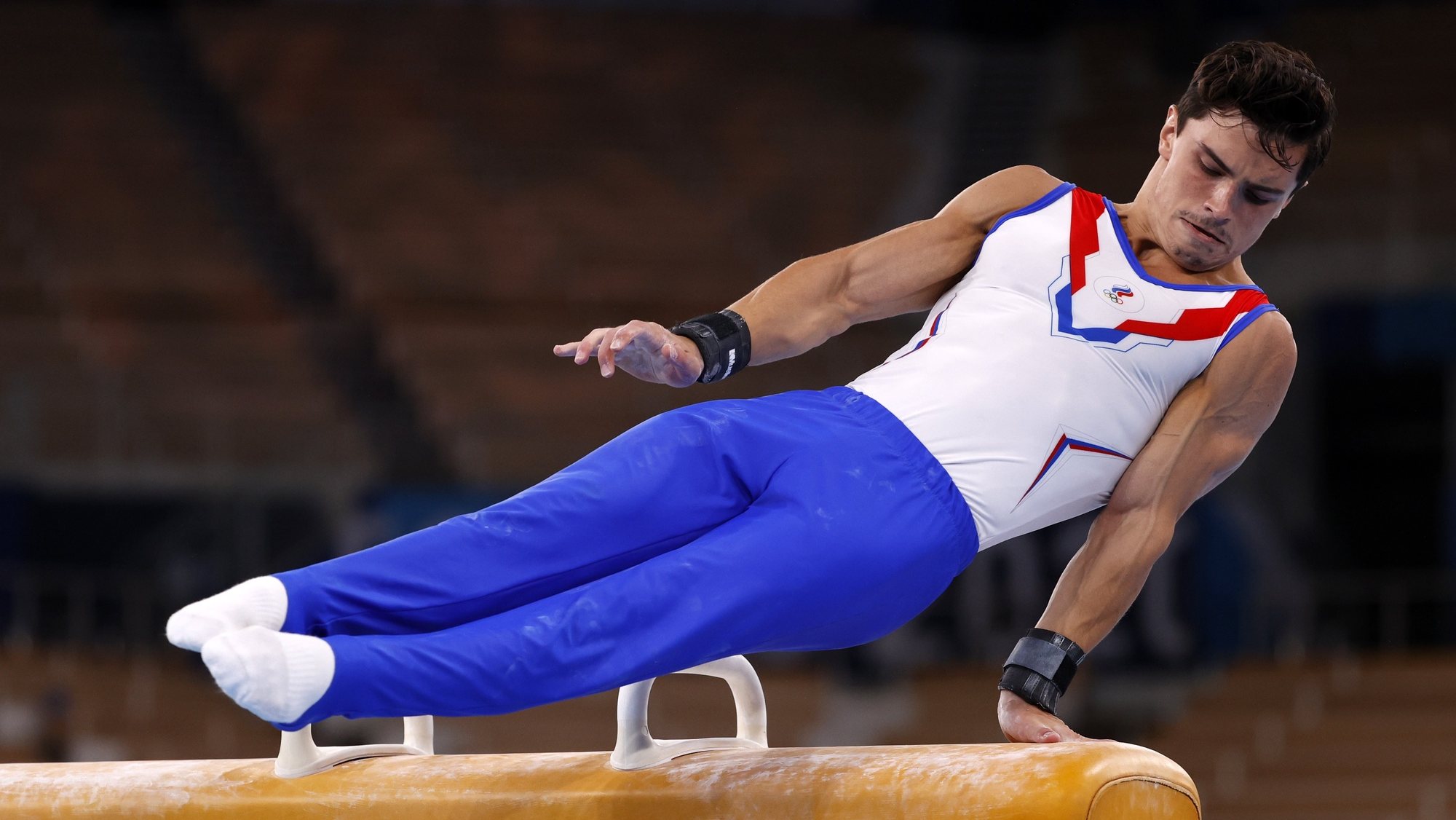 epa09367303 Artur Dalaloyan of Russia performs during the men&#039;s Pommel Horse final during the Artistic Gymnastics events of the Tokyo 2020 Olympic Games at the Ariake Gymnastics Centre in Tokyo, Japan, 26 July 2021.  EPA/HOW HWEE YOUNG