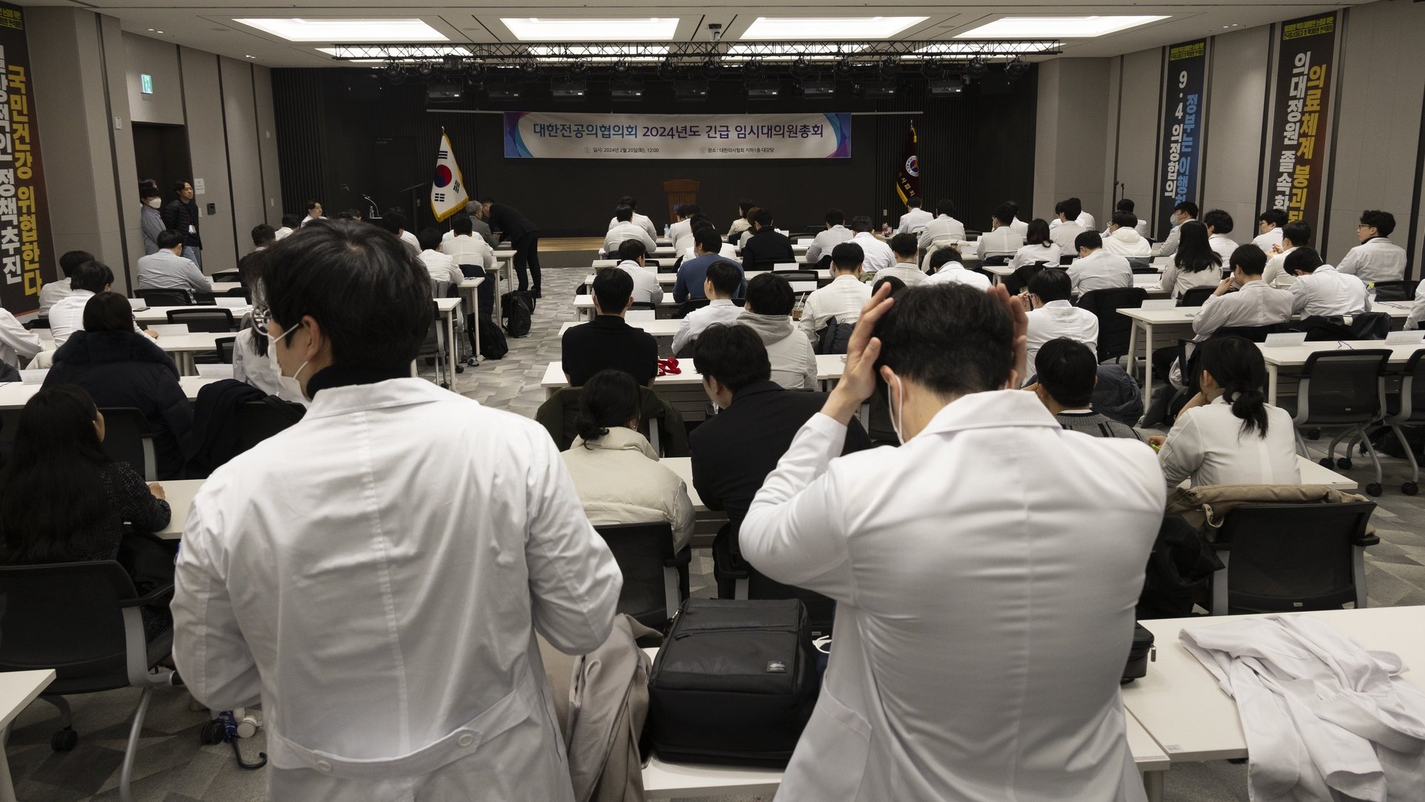 epa11167237 Trainee doctors attend an emergency meeting at the headquarters of the Korean Medical Association in Seoul, South Korea, 20 February 2024. South Korean hospitals turned away some patients and delayed surgeries on February 20, amid spiking tensions between doctors and the government over a plan to boost the number of medical students. A total of 6,415 out of the country&#039;s around 13,000 trainee doctors at 100 hospitals have submitted their resignations in protest of the plan.  EPA/JEON HEON-KYUN