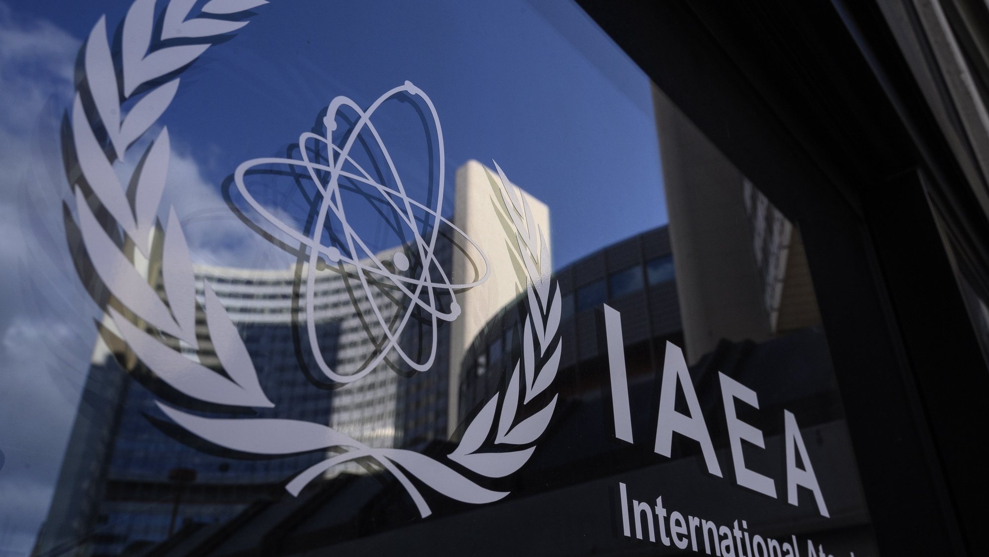 epa09224033 A logo of the International Atomic Energy Agency (IAEA) is seen in front of the IAEA headquarters of the UN seat in Vienna, Austria, 23 May 2021. A press conference of IAEA Director General Rafael Mariano Grossi is expected on 24 May 2021, after consultations with Iran regarding the technical understanding between the IAEA and Iran.  EPA/CHRISTIAN BRUNA