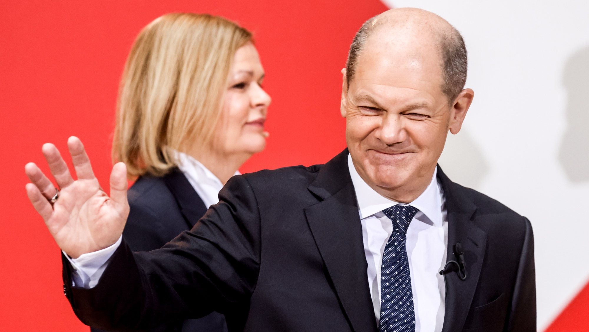epa09625348 Designated German Interior Minister Nancy Faeser (L) and designated Chancellor Olaf Scholz (R) during the Social Democrats&#039; (SPD) party presentation of its ministers for the upcoming government at the party&#039;s headquarters Willy Brandt House in Berlin, Germany, 06 December 2021.  EPA/FILIP SINGER