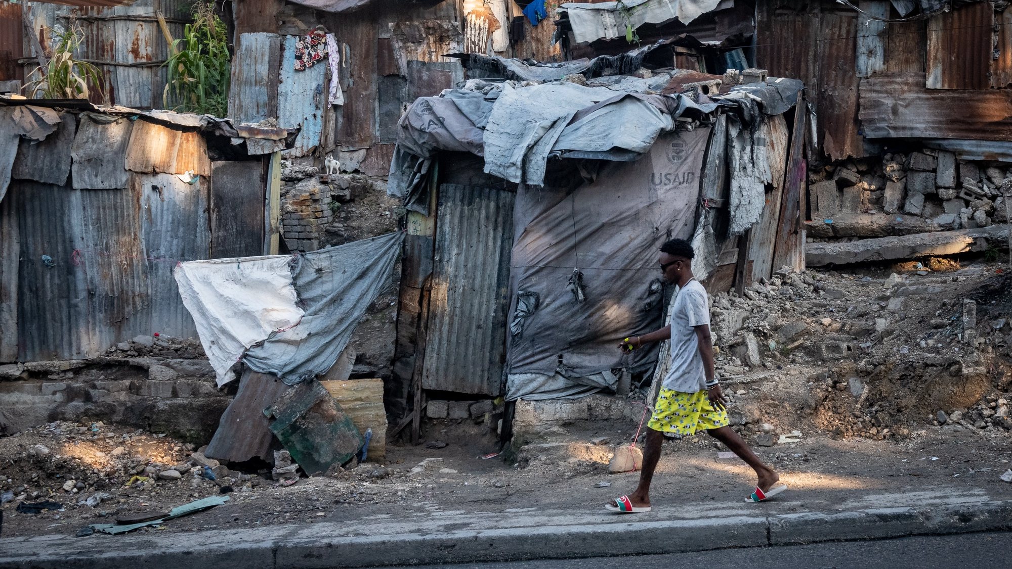 epa10401871 A man walks in downtown Port-au-Prince, Haiti, 12 January 2023. Haiti marks the 13th anniversary of the earthquake that shook the country on 12 January 2010.  EPA/Johnson Sabin