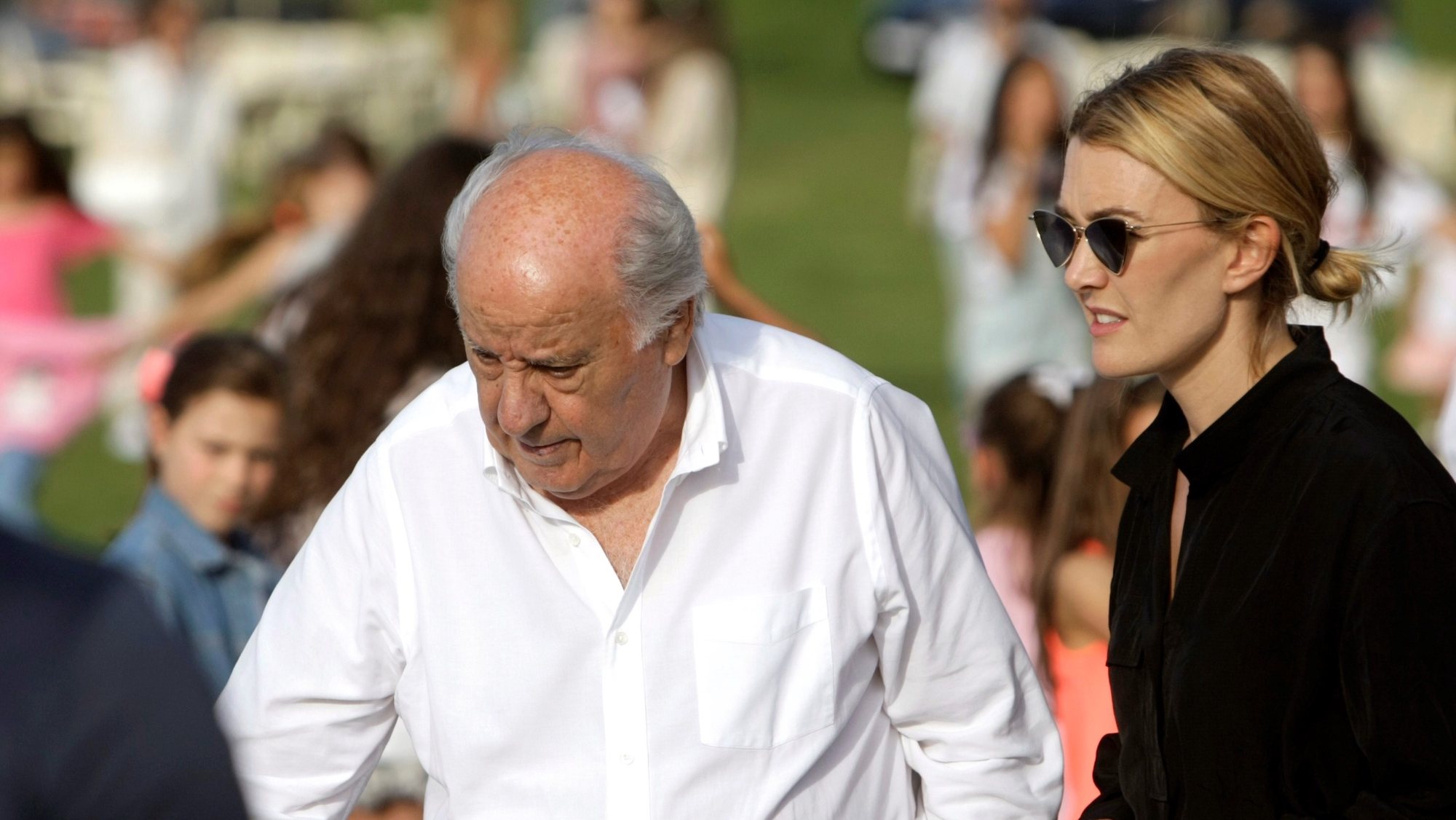 epa07727948 Inditex founder Amancio Ortega (C) and daughter Marta Ortega (R) attend the opening of the 38th International Jumping Competition in A Coruna, northwestern Spain, 19 July 2019. The competition will take place in summer at Casas Novas&#039; hippodrome.  EPA/Cabalar