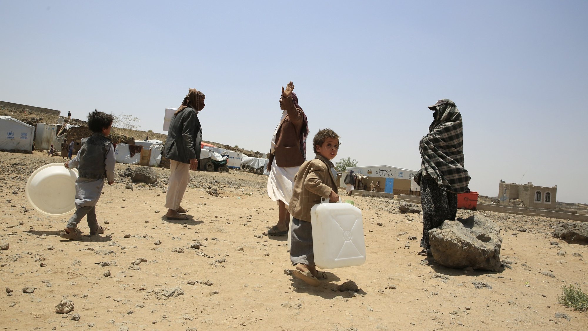 epa10010929 Displaced Yemeni children get water containers donated by the United Nations Children&#039;s Fund (UNICEF) at a camp for Internally Displaced Persons (IDPs) on the outskirts of Sana&#039;a, Yemen, 13 June 2022. The seven-year old armed conflict in Yemen has caused the internal displacement of 4.3 million Yemenis by March 2022, UNICEF has estimated. It warned that the humanitarian situation in Yemen is expected to worsen between June to December 2022 as the number of people unable to meet their minimum food needs may reach a record of 19 million people out of the country’s 30 million population by the end of 2022 due to the decline in donor funding for humanitarian operations.  EPA/YAHYA ARHAB