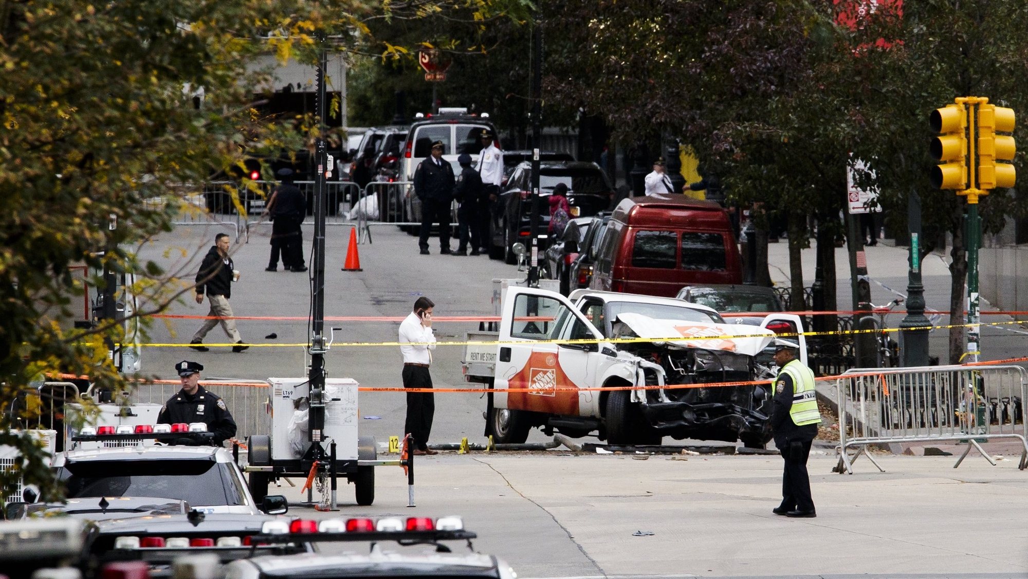 epa06302061 Investigators work at the scene of an attack on 31 October where a man driving a truck killed eight people and injured 11 in New York, New York, USA, 01 November 2017. The attacker, Sayfullo Saipov, was shot after jumping out of the truck and is in critical condition. The attack is being investigated as a terrorist incident.  EPA/JUSTIN LANE