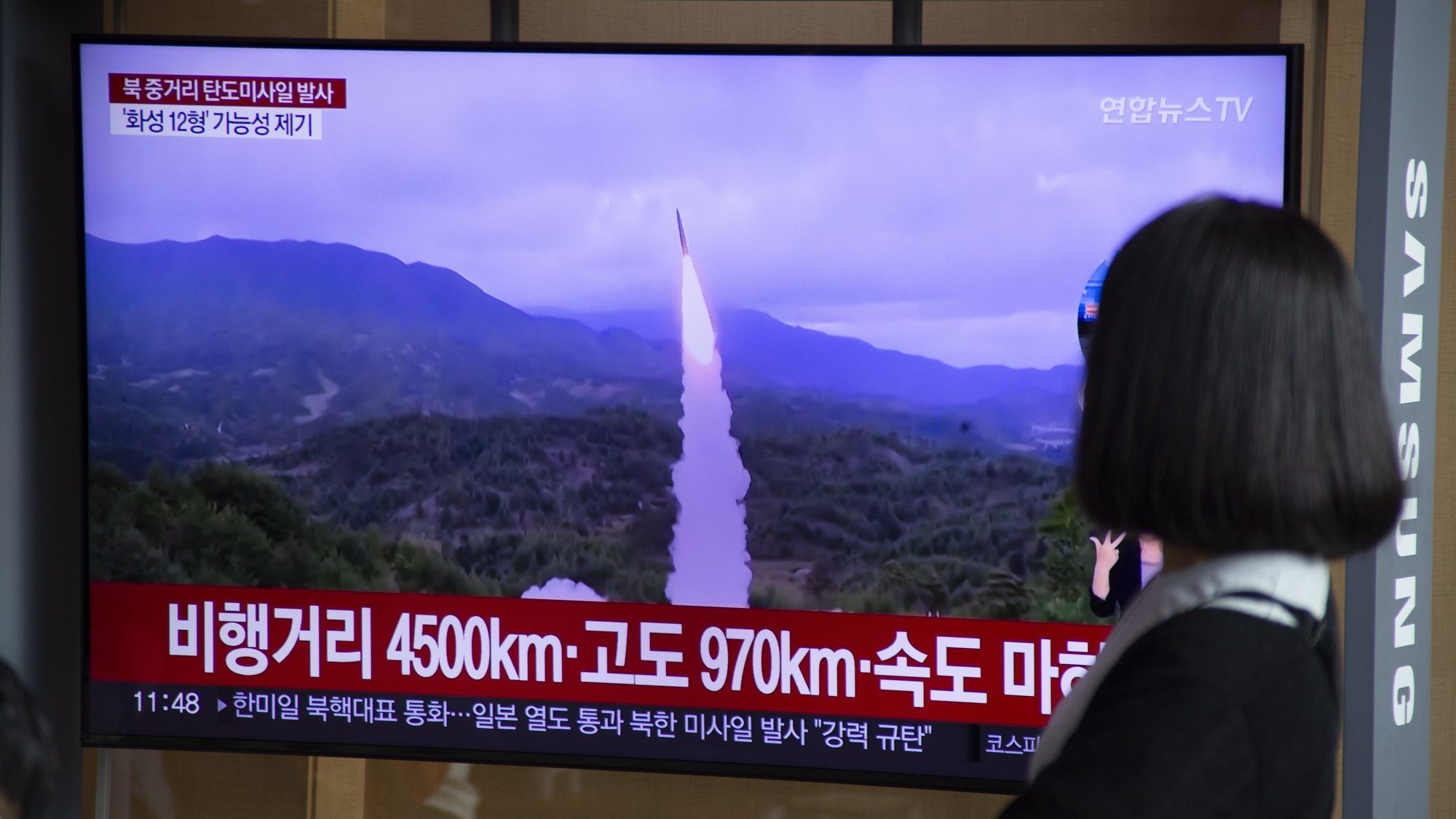 epa10222065 A woman watches the news at a station in Seoul, South Korea, 04 October 2022. According to South Korea&#039;s Joint Chiefs of Staff (JCS), North Korea launched a ballistic missile over Japan into the Pacific Ocean.  EPA/JEON HEON-KYUN
