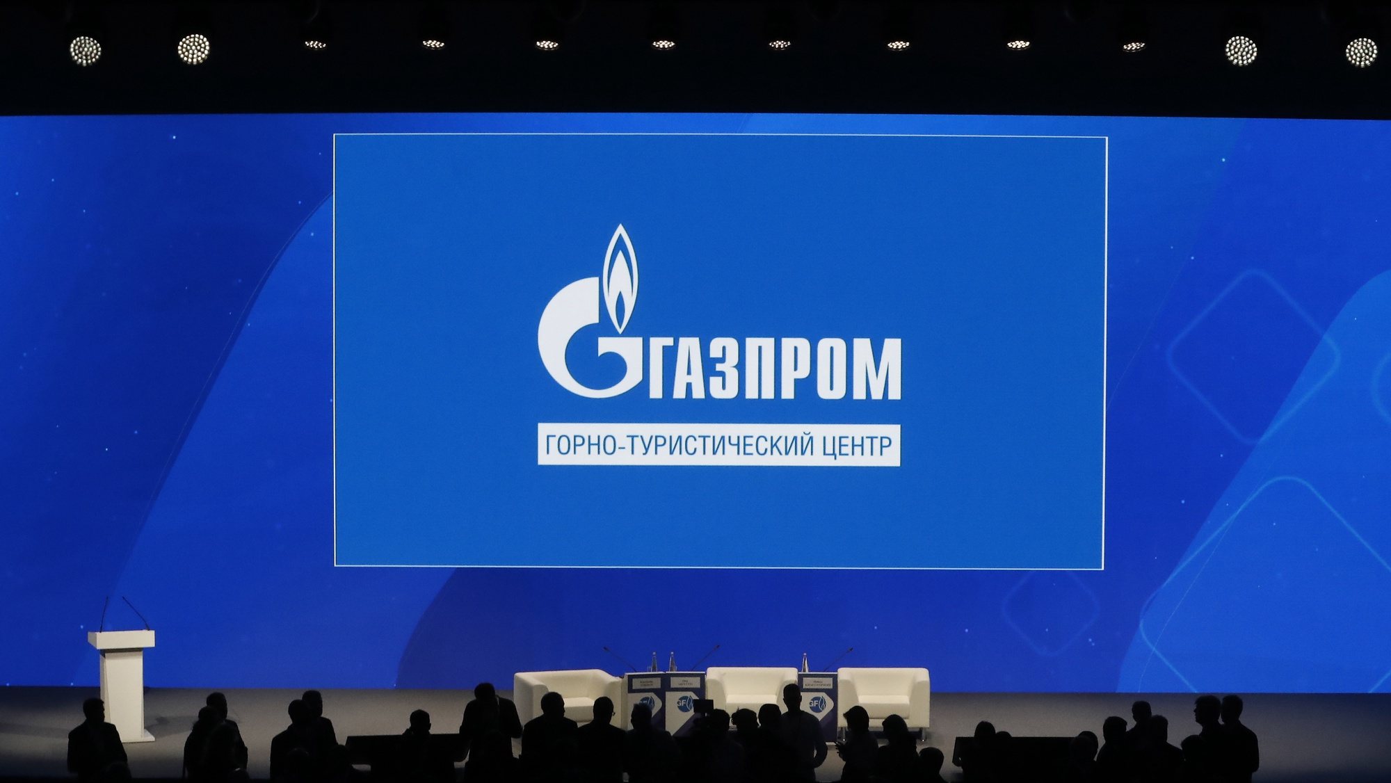 epa10185586 Participants in front of a large screen shows Gazprom Company before the plenary session â€˜Russian Gas Industry: Development Priorities in New Conditionâ€™ at the St. Petersburg International Gas Forum (SPIGF) in St. Petersburg, Russia, 15 September 2022. The 11th St.Petersburg International Gas Forum runs from 13 to 16 September 2022.  EPA/ANATOLY MALTSEV