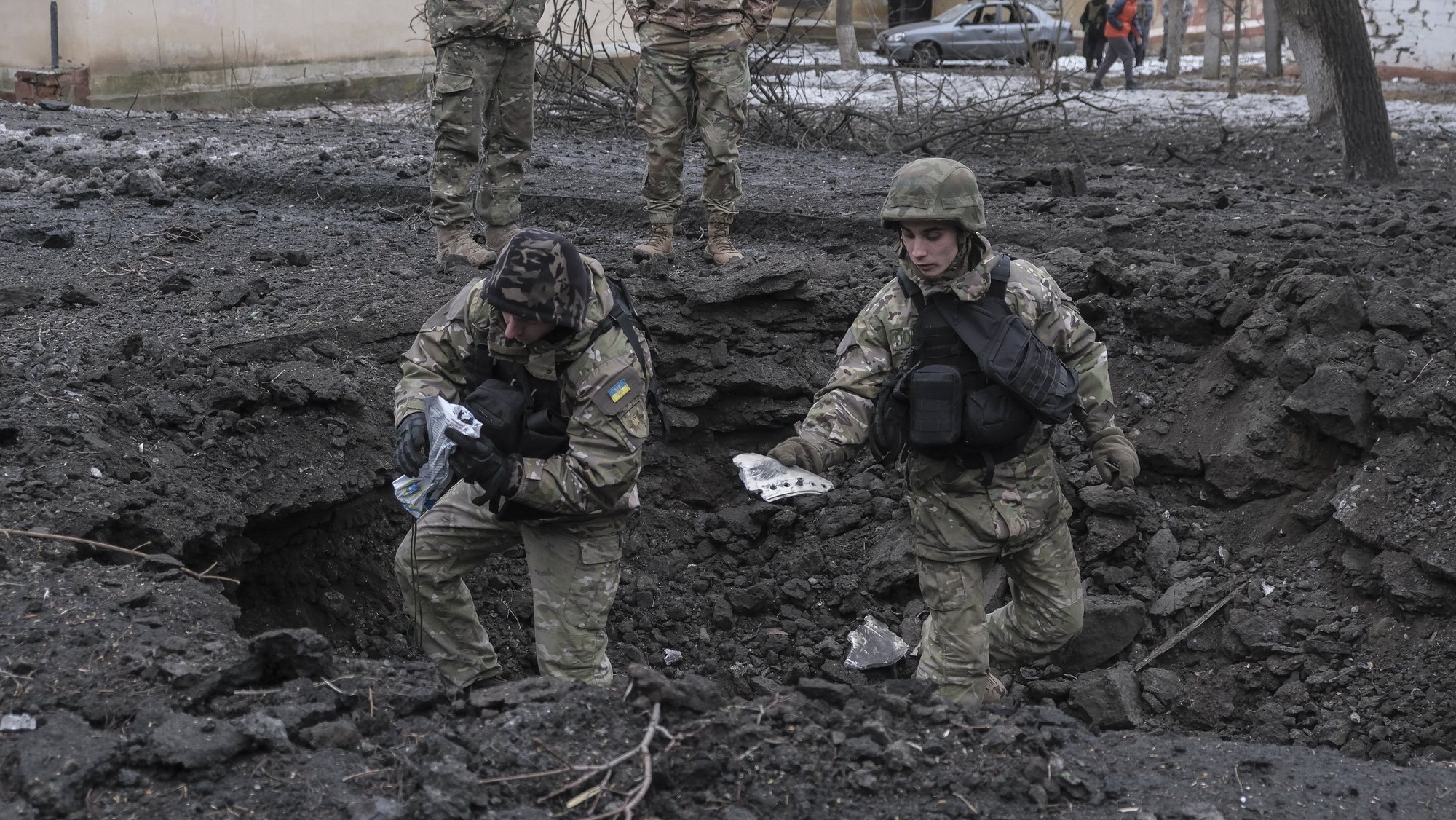 epa10444412 Ukrainian servicemen inspect a shell crater after a rocket attack on a residential area in Kramatorsk, Donetsk region, eastern Ukraine, 02 February 2023, amid Russia&#039;s invasion. At least five people were injured after two rockets hit on the day a residential area in Kramatorsk, the head of Ukraine&#039;s Donetsk Regional Military Administration, Pavlo Kyrylenko said in a statement. The rockets hit an area near the site of overnight shelling on a four-story residential building, where at least three people were killed and 18 others injured, according to the State Emergency Service of Ukraine (SES). Russian troops entered Ukraine territory on 24 February 2022 starting a conflict that has provoked destruction and a humanitarian crisis.  EPA/SERGEY SHESTAK