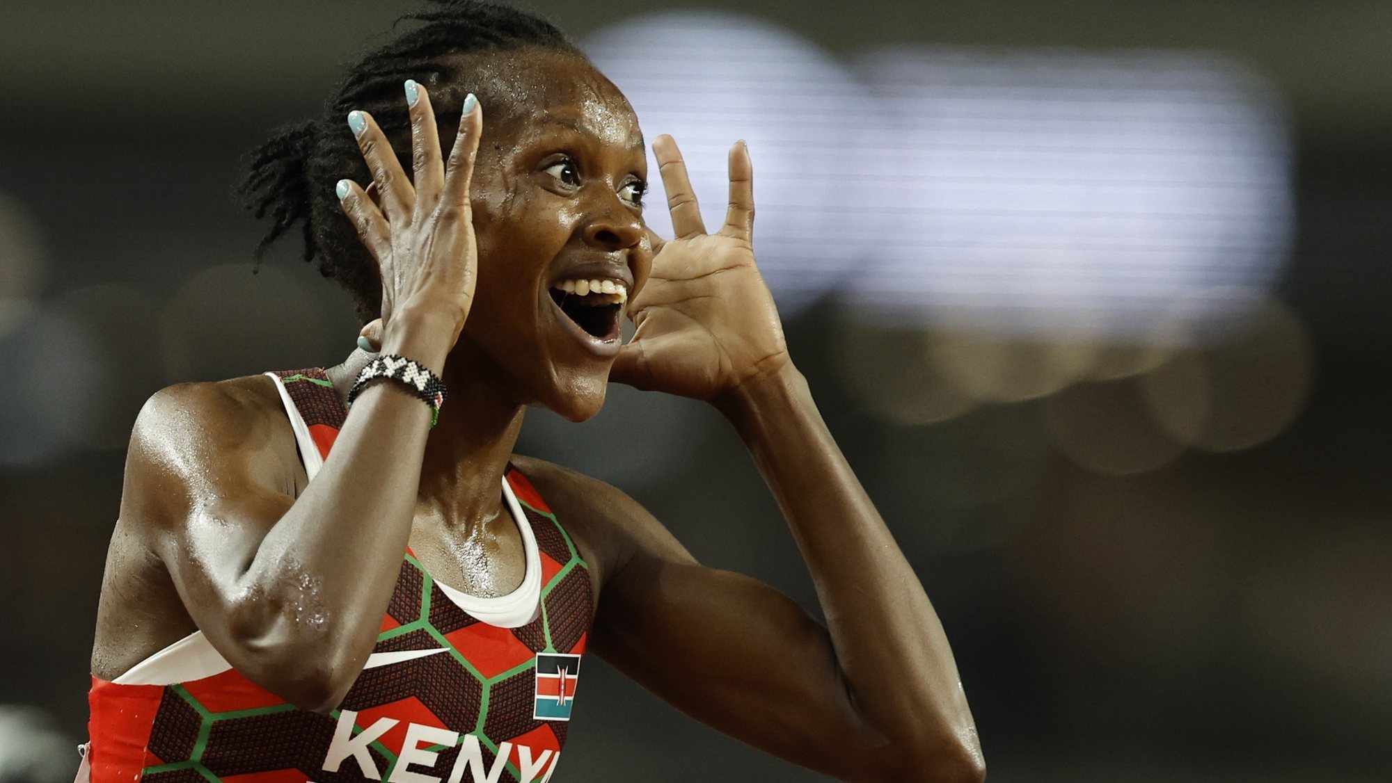 epa10822203 Faith Kipyegon of Kenya celebrates winning the 5000 Metres Women final at the World Athletics Championships in Budapest, Hungary, 26 August 2023.  EPA/ROBERT GHEMENT