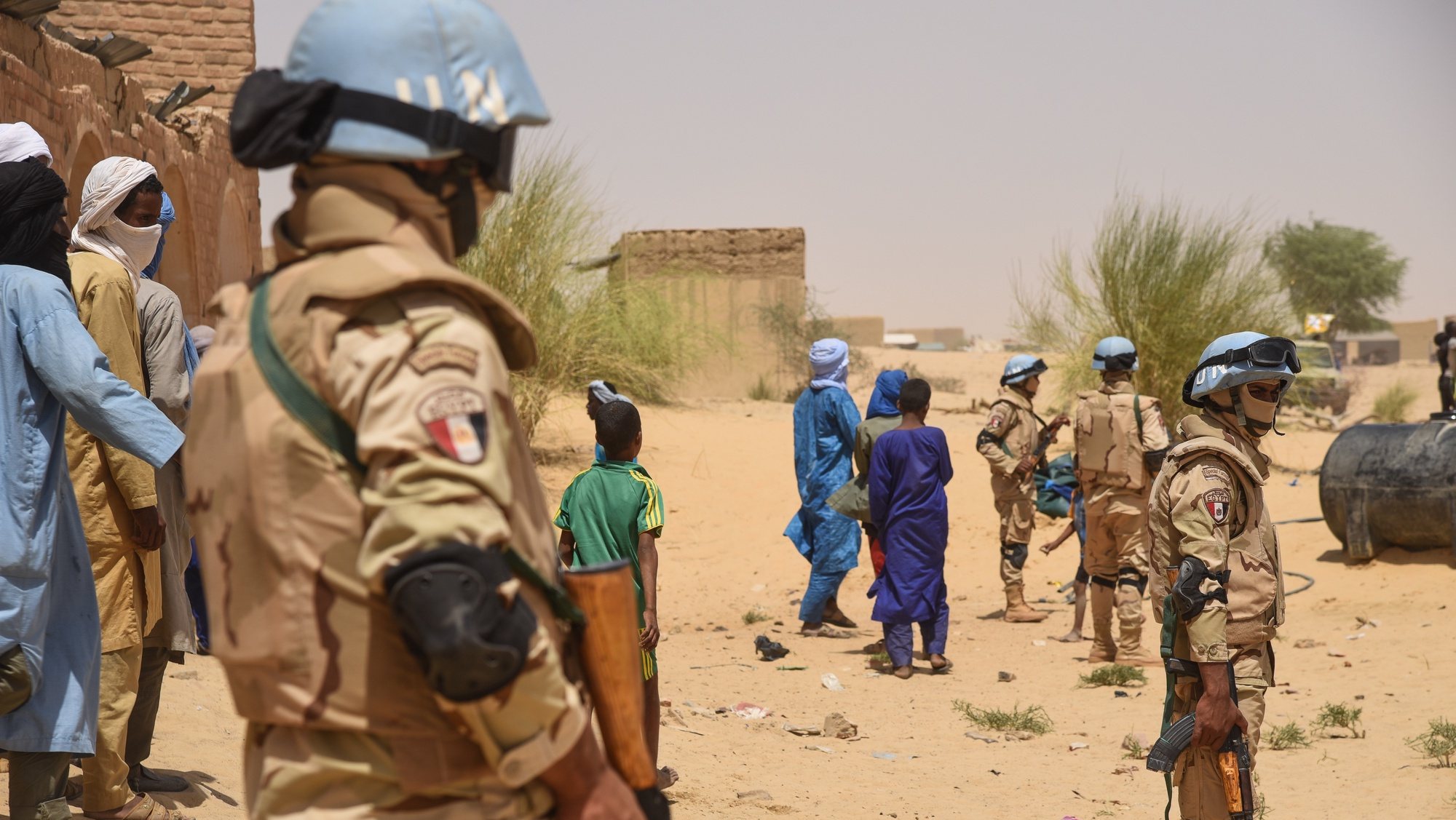 epa07558008 United Nations (UN) Peacekeepers secure the area as part of a United Nations High Commissioner for Refugees (UNHCR) and United Nations Multidimensional Integrated Stabilization Mission in Mali (MINUSMA) delegation visit Koygouma in the Timbuktu Region of Mali, 06 May 2019 (issued 09 May 2019). This visit follows the repatriation of 2086 Malian refugees from the Mbera camp in Mauritania last April, who had to flee conflict in 2013. Vehicles from the High Council for Azawad Unity (HCUA) also came to secure the area. In Koygouma the HCUA member of the Coordination of Azawad movements (CMA) is very present. This rebel group that signed the Algiers peace agreement mainly composed of Ansar Dine dissidents is often criticized for its double game with Ansar Dine jihadists and its proximity to Iyad Ag Ghali. Although the security situation in Mali is still volatile, according to UNHCR, many refugees decided to return to Mali.  EPA/NICOLAS REMENE  ATTENTION: This Image is part of a PHOTO SET