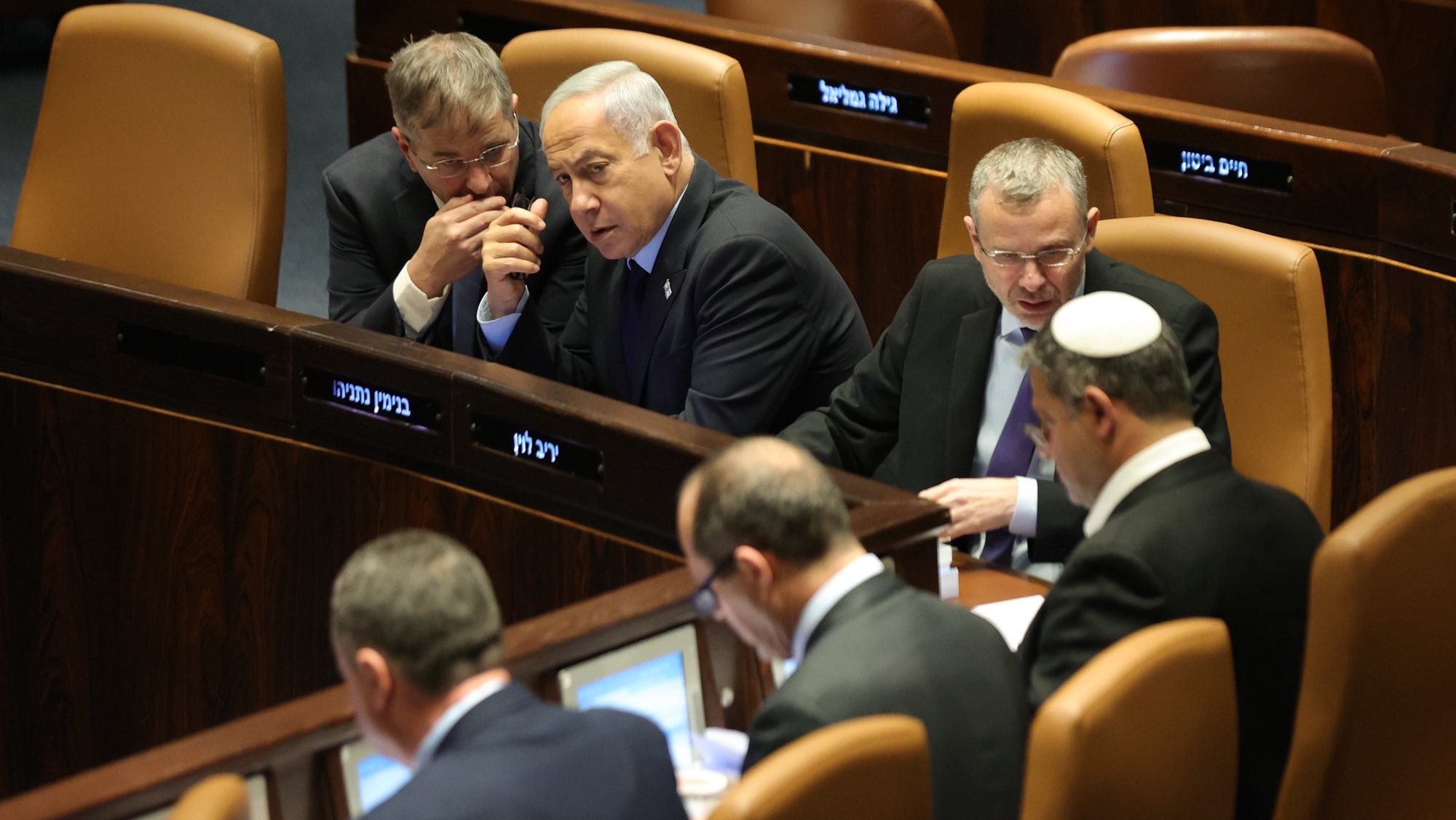 epa10536863 Israeli Prime Minister Benjamin Netanyahu (2-L) attends a voting session on judicial reform bill at the Knesset Plenum, in Jerusalem, Israel, 22 March 2023. Nationwide protests against the government&#039;s judicial reform plans are being held for 12 weeks in a row. Israel&#039;s parliament passed a draft law limiting the power of the Israeli Supreme Court in a first reading on 14 March.  EPA/ABIR SULTAN