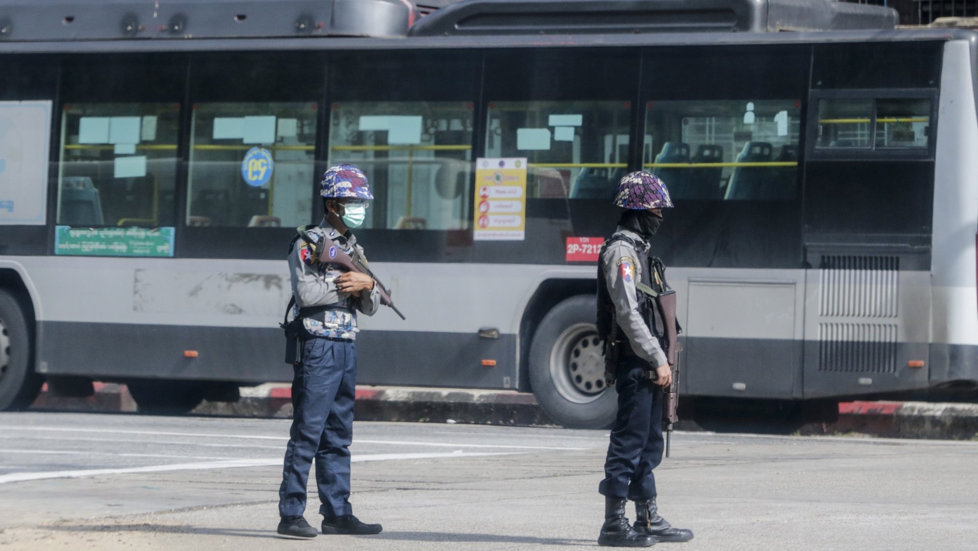epa09408114 Armed policemen stand guard as they block a road after several explosions occurred at downtown area in Yangon, Myanmar, 10 August 2021. Reports indicate at least five explosions occurred in the afternoon of 10 August. No casualties or injuries reported by authority.  EPA/STRINGER