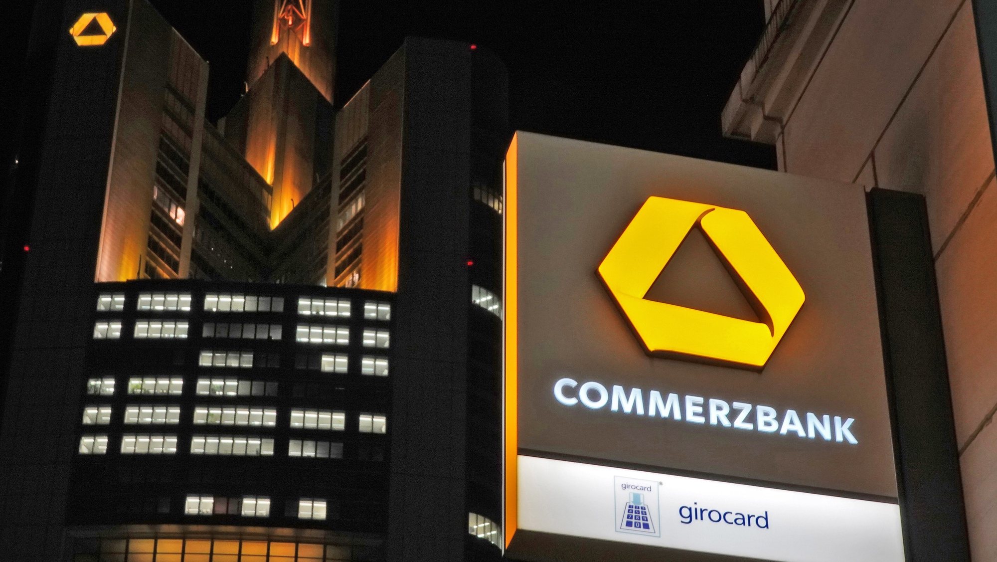epa08798067 (FILE) - An image showing Commerzbank office tower seen behind a Commerzbank signage at a local branch in Frankfurt, Germany, late 16 January 2020 (reissued 04 November 2020). Commerzbank is to publish their 3rd quarter 2020 results on 05 November 2020.  EPA/MAURITZ ANTIN *** Local Caption *** 55784107