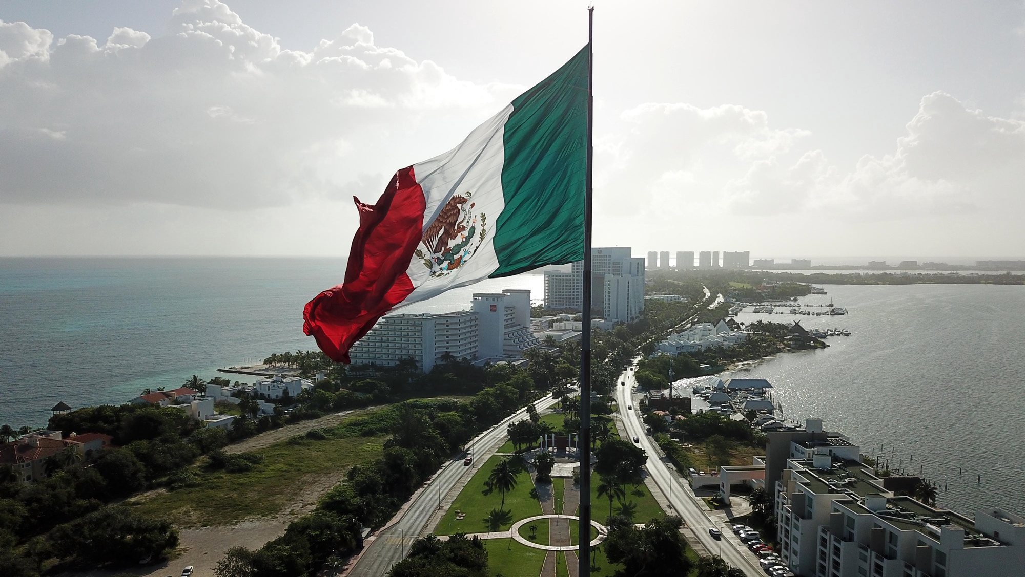 epa07393875 General view of a monumental flag of Mexico in Cancun, Quintana Roo, Mexico, 24 February 2019. The resort of Cancun, in the Mexican Caribbean, is one of the 15 points where monumental flags of Mexico wave and its care requires special treatment by a group of experts from the Mexican Army and the Secretariat of National Defense. The flags measure 50 meters long by 26 meters wide and weigh about 200 kilos, while each of them measures more than 100 meters in height.  EPA/ALONSO CUPUL