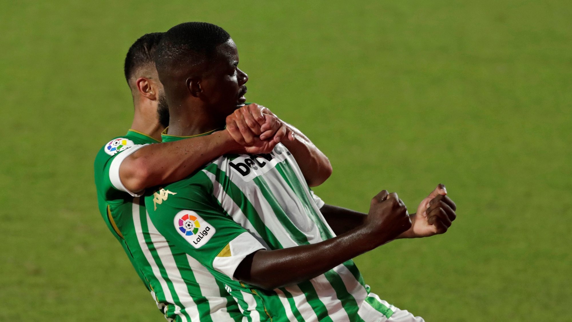 epa08699841 Betis&#039; midfielder William Carvalho (R) celebrates with teammate Nabil Fekir (L) after scoring the 2-1 goal during the Spanish LaLiga soccer match between Real Betis and Real Madrid held at Benito Villamarin Stadium in Seville, Spain, 26 September 2020.  EPA/JULIO MUNOZ