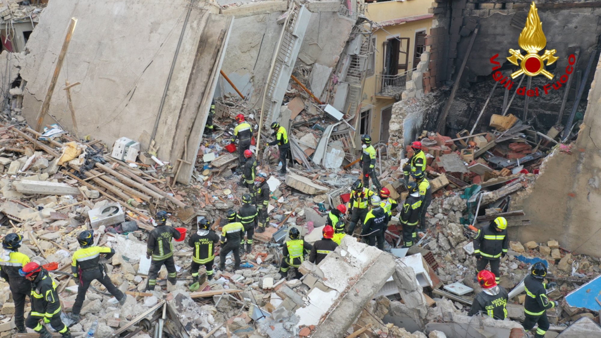 epa09637934 A handout picture provided by the Vigili del Fuoco shows an aerial view of the damage following a blast caused by a gas leak in Ravanusa, Sicily, Italy, 12 December 2021. Firefighters found a fourth body in the rubble of the collapsed buildings; two survivors were rescued, five people are still missing.  EPA/VIGILI DEL FUOCO HANDOUT  HANDOUT EDITORIAL USE ONLY/NO SALES