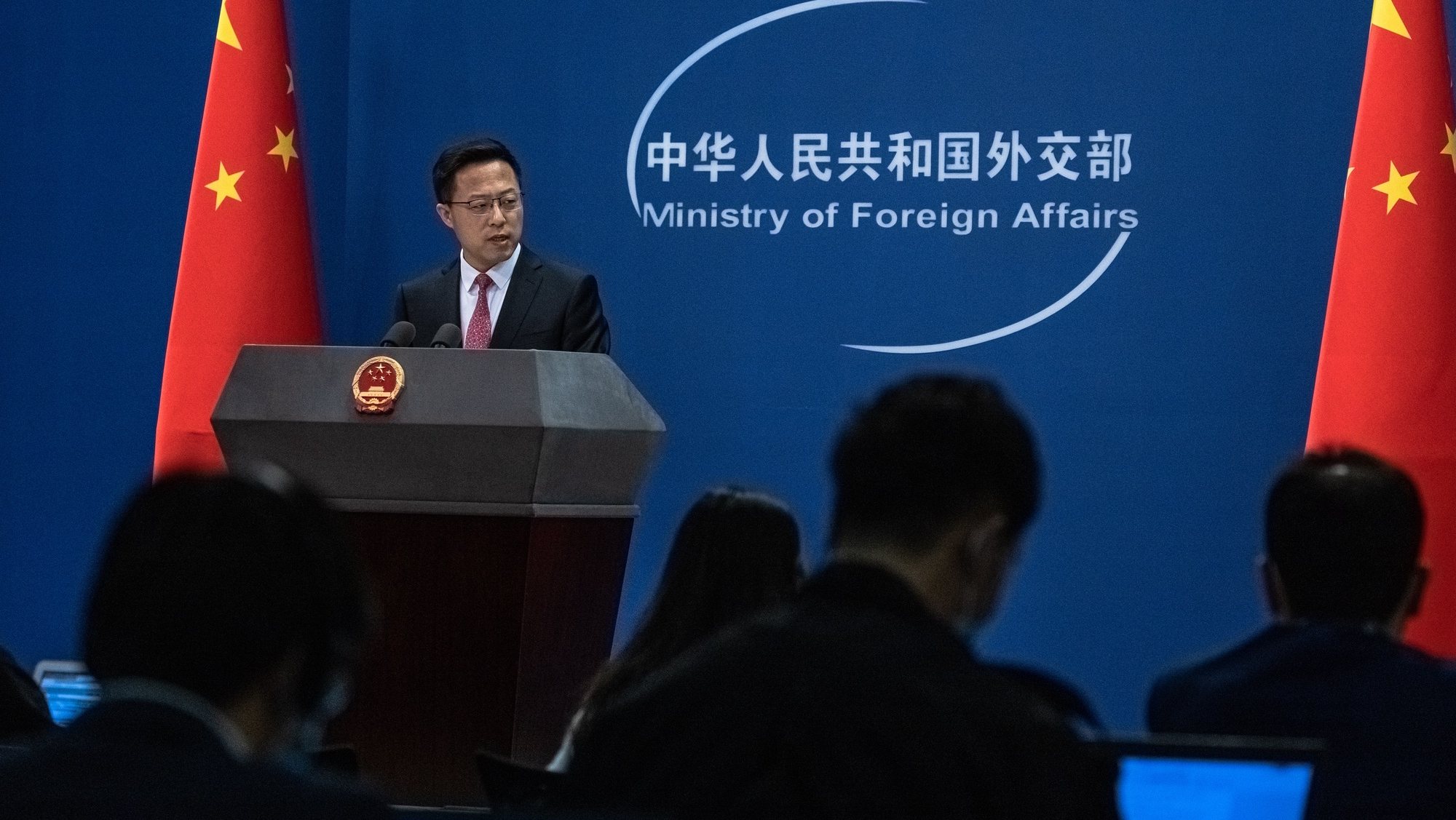 epa09083383 Chinese Foreign Ministry spokesman Zhao Lijian speaks during a daily media briefing in Beijing, China, 19 March 2021. Canadians Michael Spavor and Michael Kovrig, detained by Chinese authorities in 2018 and accused of espionage, will go on trial on 19 and 22 March 2021.  EPA/ROMAN PILIPEY