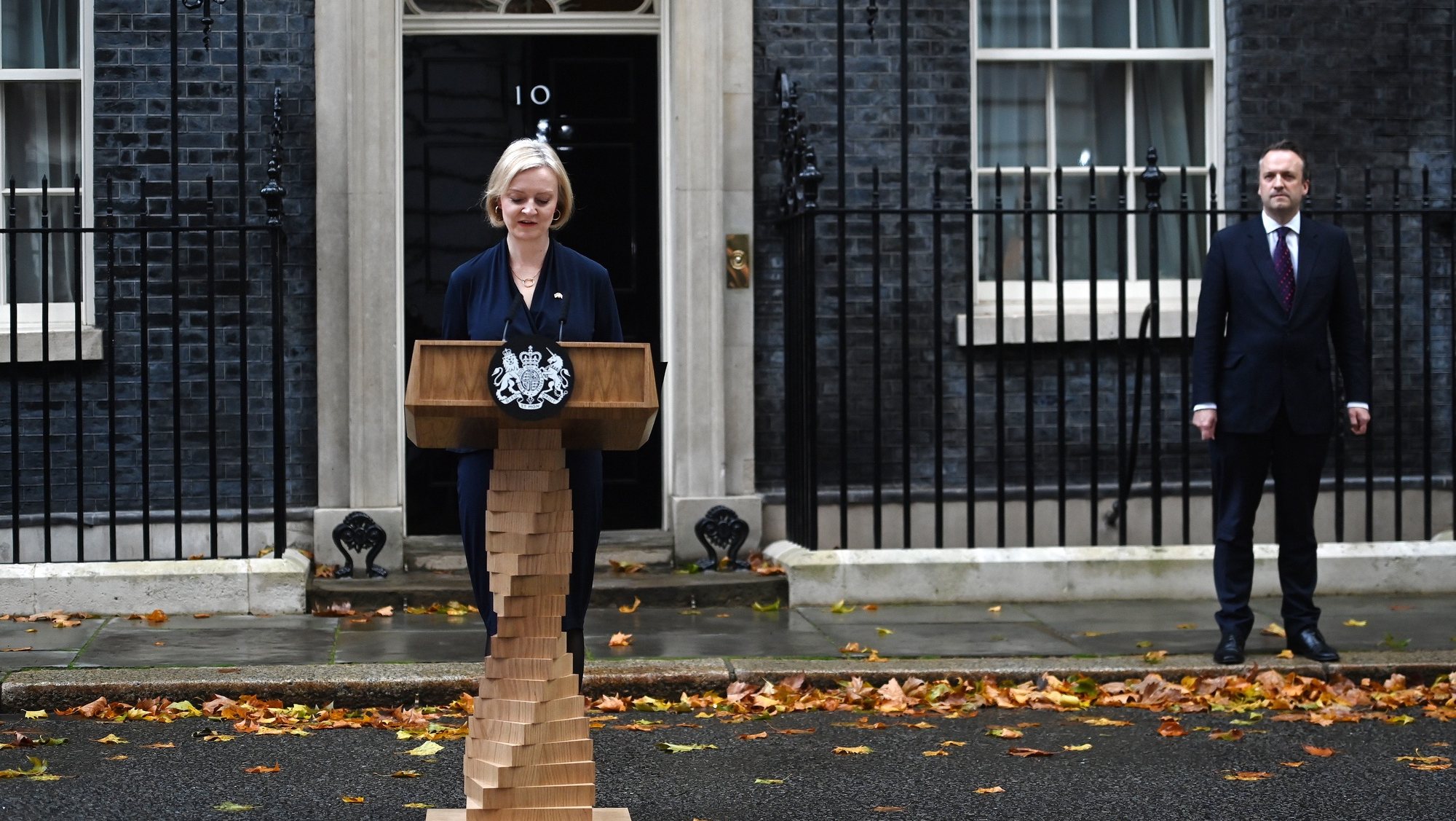 epa10254386 British Prime Minister Liz Truss delivers a resignation statement outside 10 Downing Street in London, Britain, 20 October 2022. Truss gave in to increasing calls for her to resign from Tory MPs. She will remain in power until a new Prime Minister will be appointed.  EPA/ANDY RAIN