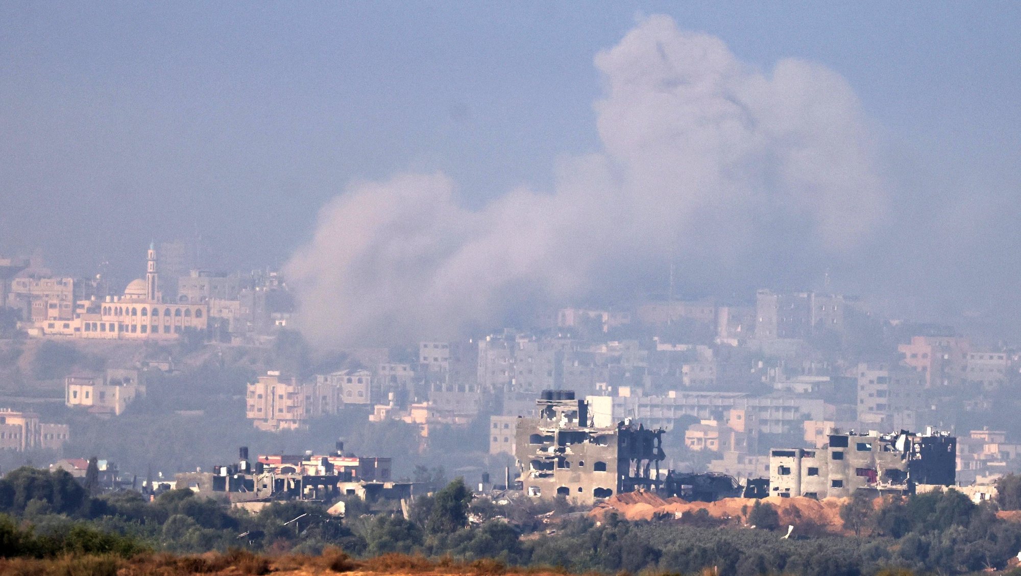 epa10963848 Smoke billows from the ruins of destroyed buildings in the northern part of the Gaza Strip, as seen from Sderot, southern Israel, 08 November 2023. More than 10,000 Palestinians and at least 1,400 Israelis have been killed, according to the Israel Defense Forces (IDF) and the Palestinian health authority, since Hamas militants launched an attack against Israel from the Gaza Strip on 07 October, and the Israeli operations in Gaza and the West Bank which followed it. On 08 November, the Israeli Defence Forces (IDF) reported ongoing military operations within the Gaza Strip, including direct airstrikes on Hamas infrastructure.  EPA/NEIL HALL