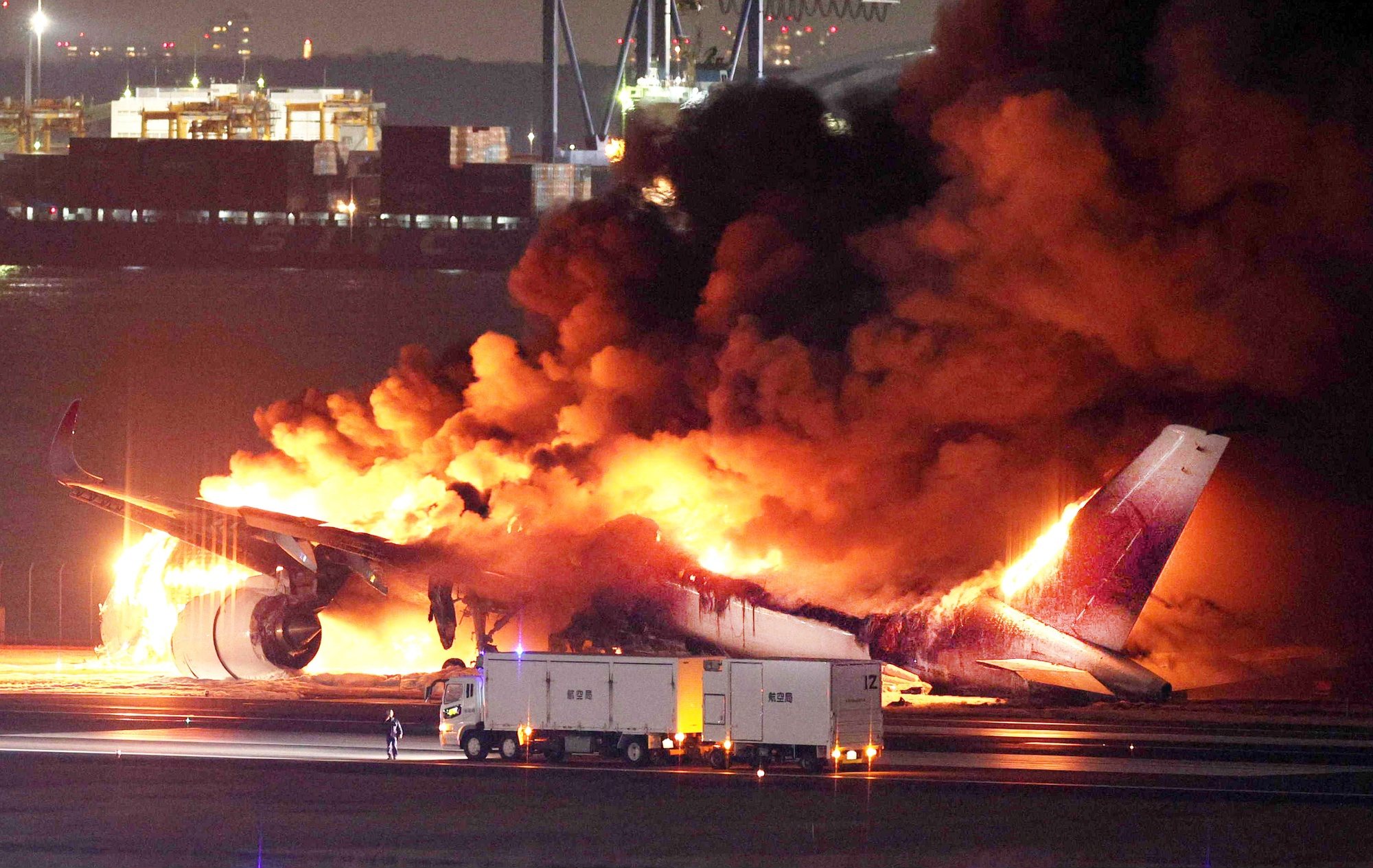 epa11053270 A Japan Airline (JAL) passenger plane bursts into flames on the tarmac at Haneda Airport in Tokyo, Japan, 02 January 2024, after its landing. The JAL airplane apparently collided with a Japan Coast Guard plane as it landed. All 379 people on the JAL plane, including 367 passengers and 12 crew members, have been safely evacuated, according to JAL. The coast guard plane carried six crew members, one escaped from the aircraft and the others were unaccounred for, the coast guard said.  EPA/JIJI PRESS JAPAN OUT EDITORIAL USE ONLY/