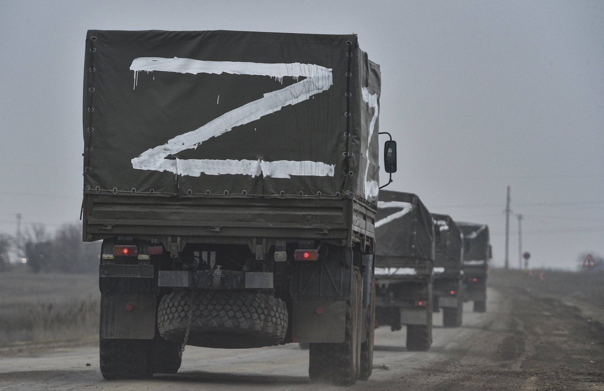 epa09840168 (FILE) - Russian troops move towards Ukraine on the road near Armiansk, Crimea, 25 February 2022 (reissued 21 March 2022). Russian troops entered Ukraine on 24 February prompting the country&#039;s president to declare martial law and triggering a series of announcements by Western countries to impose severe economic sanctions on Russia. More than three million Ukrainians became refugees, around 700 civilians were killed and over 1.000 more inured in the month-long conflict, the United Nations said.  EPA/STRINGER  ATTENTION: This Image is part of a PHOTO SET