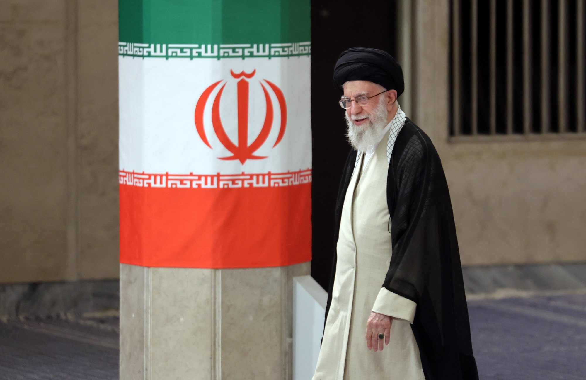 epa11458340 Iranian Supreme Leader Ayatollah Ali Khamenei arrives to cast his vote during the presidential election in Tehran, Iran, 05 July 2024. Iran holds the second round of the presidential election on 05 July 2024.  EPA/STR