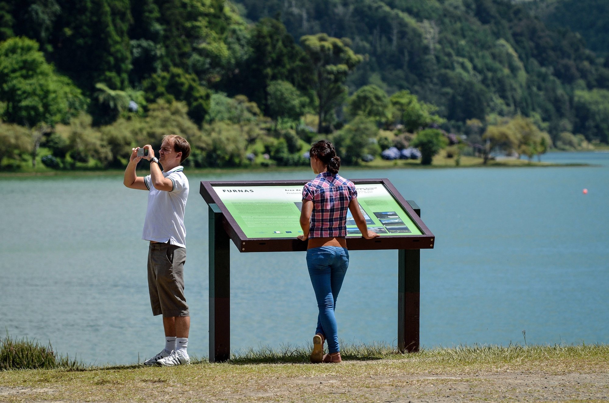 epa08617790 Tourists visit the Lagoa das Furnas, in Furnas, Sao Miguel island, Azores, Portugal, 18 August 2020 (issued 22 August 2020). The number of tourists in Furnas, Azores is much smaller than in previous years due to teh effect of travel restrictions in posed by coutries in an attempt to stem the widespread of the SARS-CoV-2 coronavirus which causes the Covid-19 disease.  EPA/EDUARDO COSTA