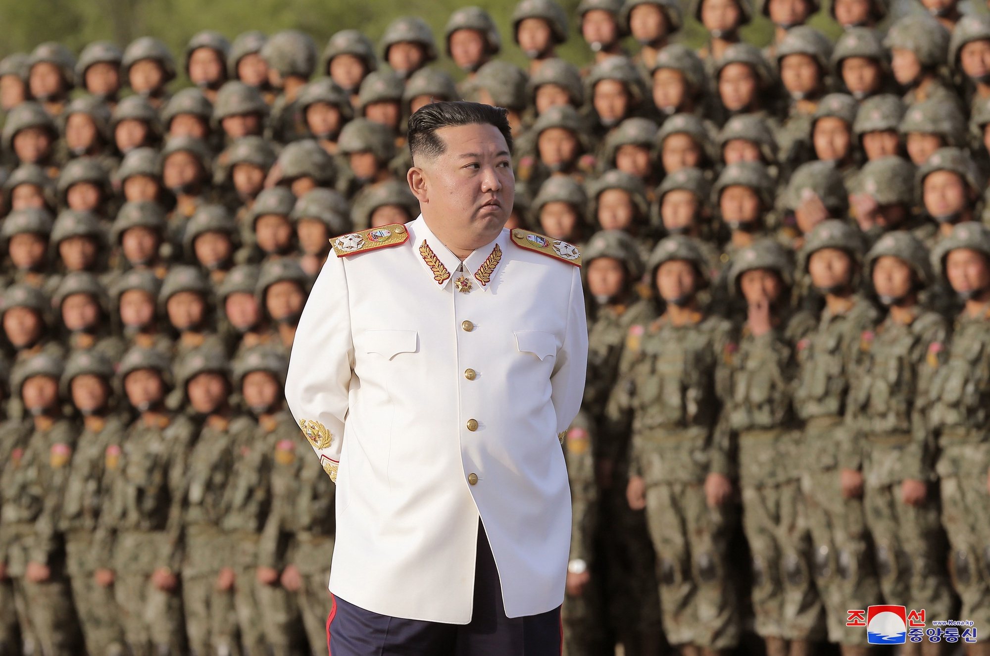 epa09915666 A photo released by the official North Korean Central News Agency (KCNA) shows North Korean Supreme Leader Kim Jong-Un wearing a white marshal uniform, during a photo session with the officers and soldiers that took part in a military parade, in Pyongyang, North Korea, 27 April 2022 (issued 29 April 2022). The soldiers participated in a military parade in Pyongyang on April 25 to mark the 90th anniversary of the Korean People&#039;s Revolutionary Army.  EPA/KCNA   EDITORIAL USE ONLY